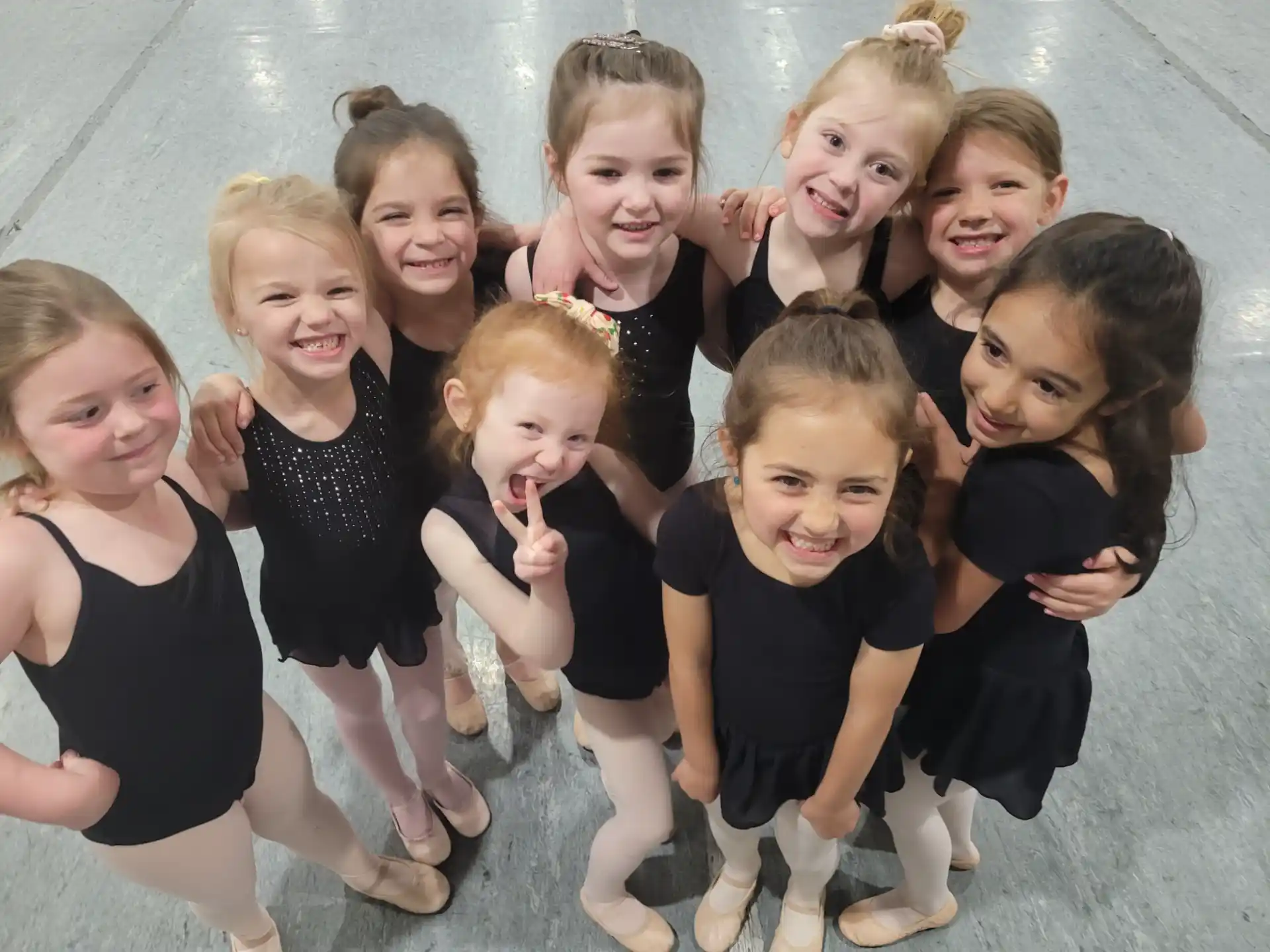 a group of girls posing for a photo