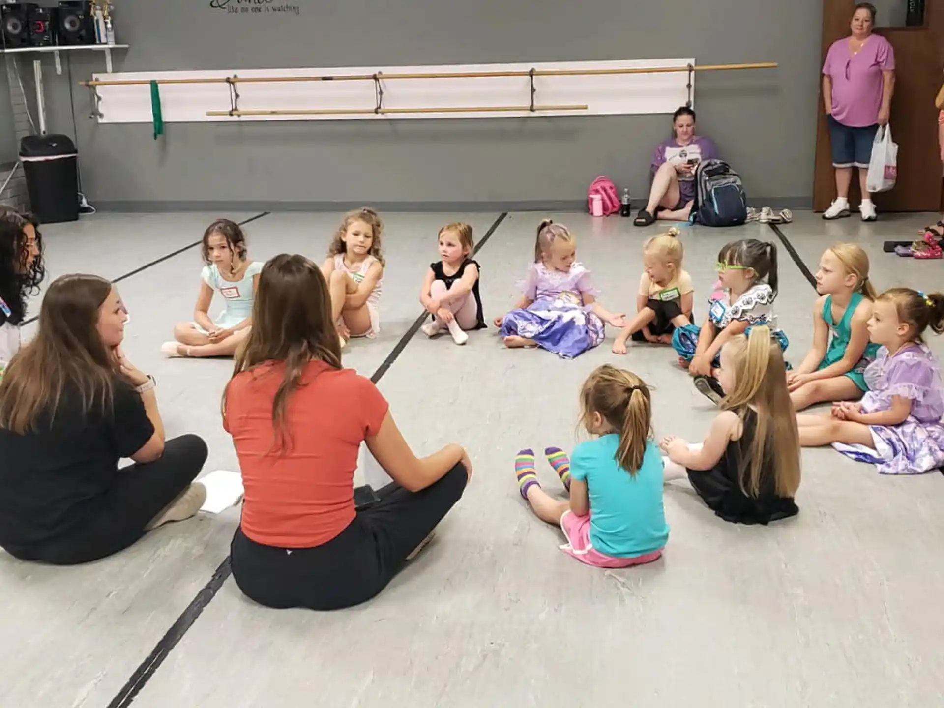 a group of people sitting on the floor