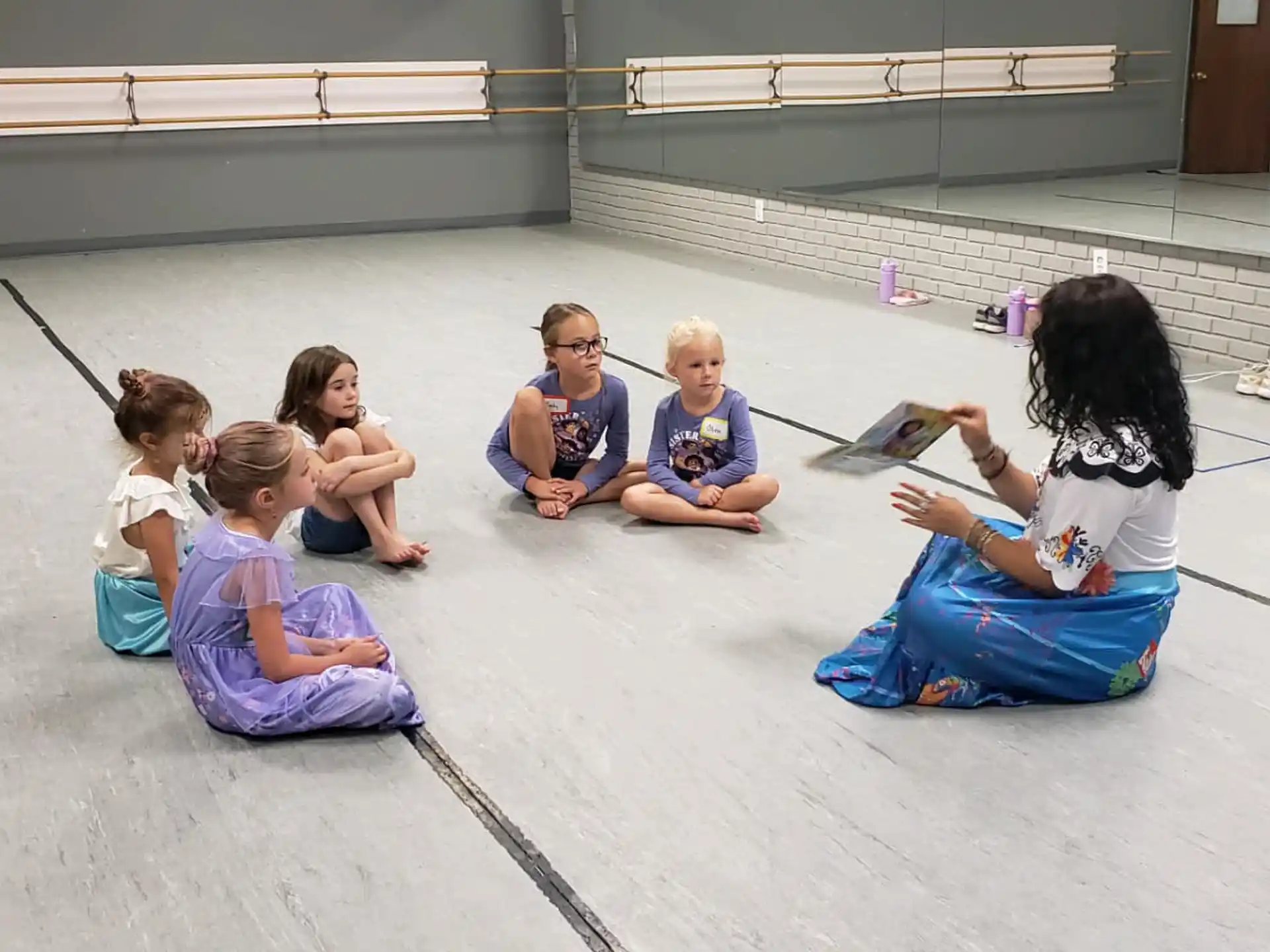 a group of people sitting on the floor