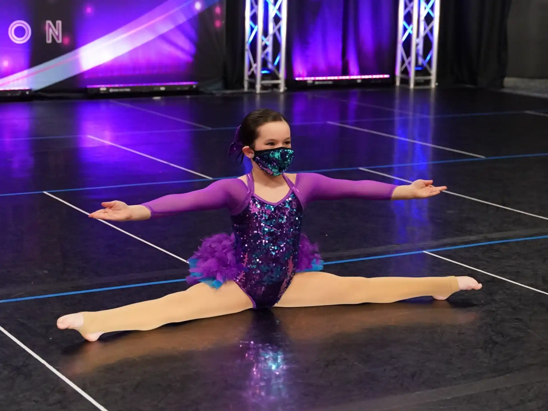 a person in a tutu on a stage