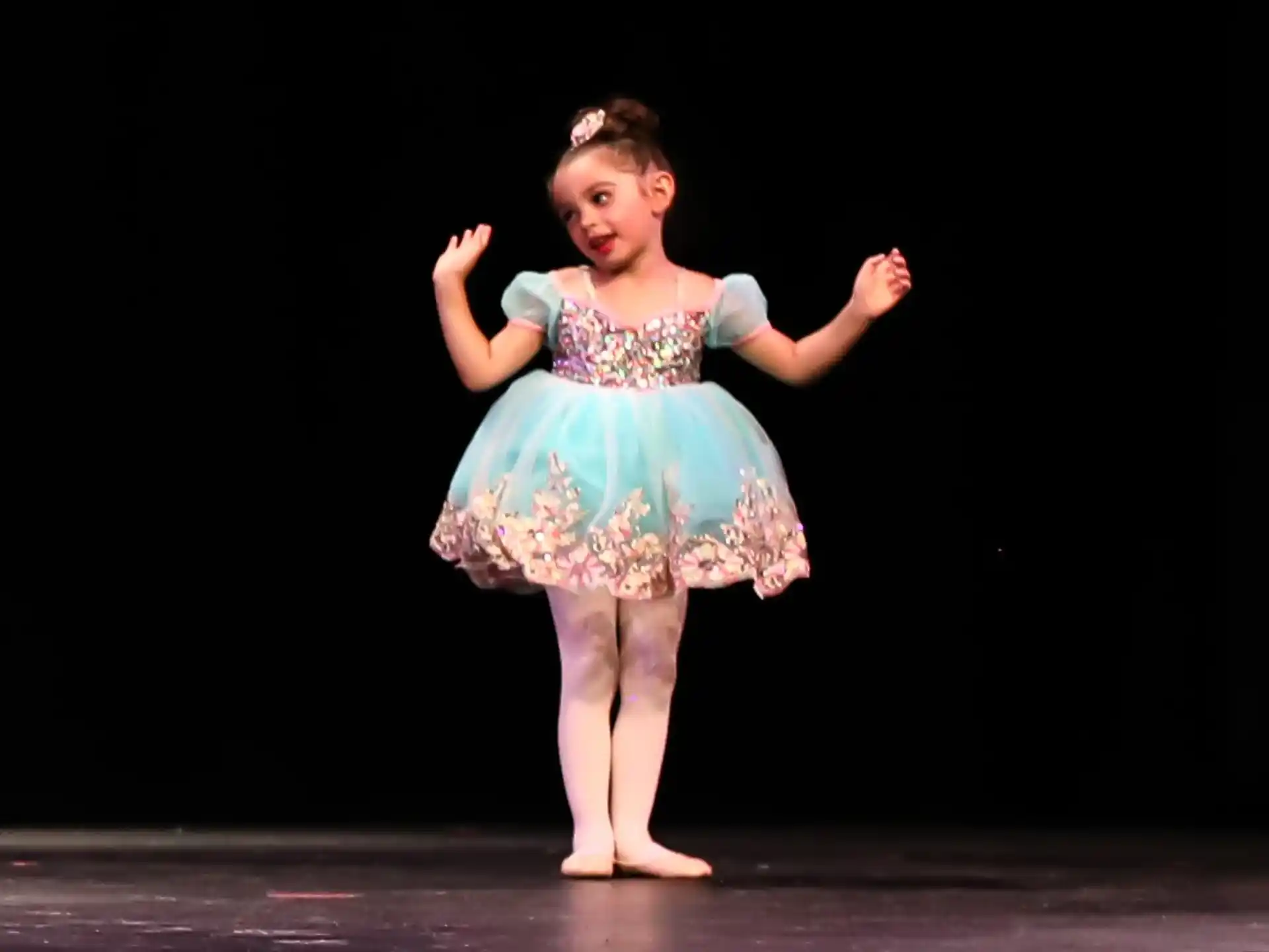 a girl in a dress dancing