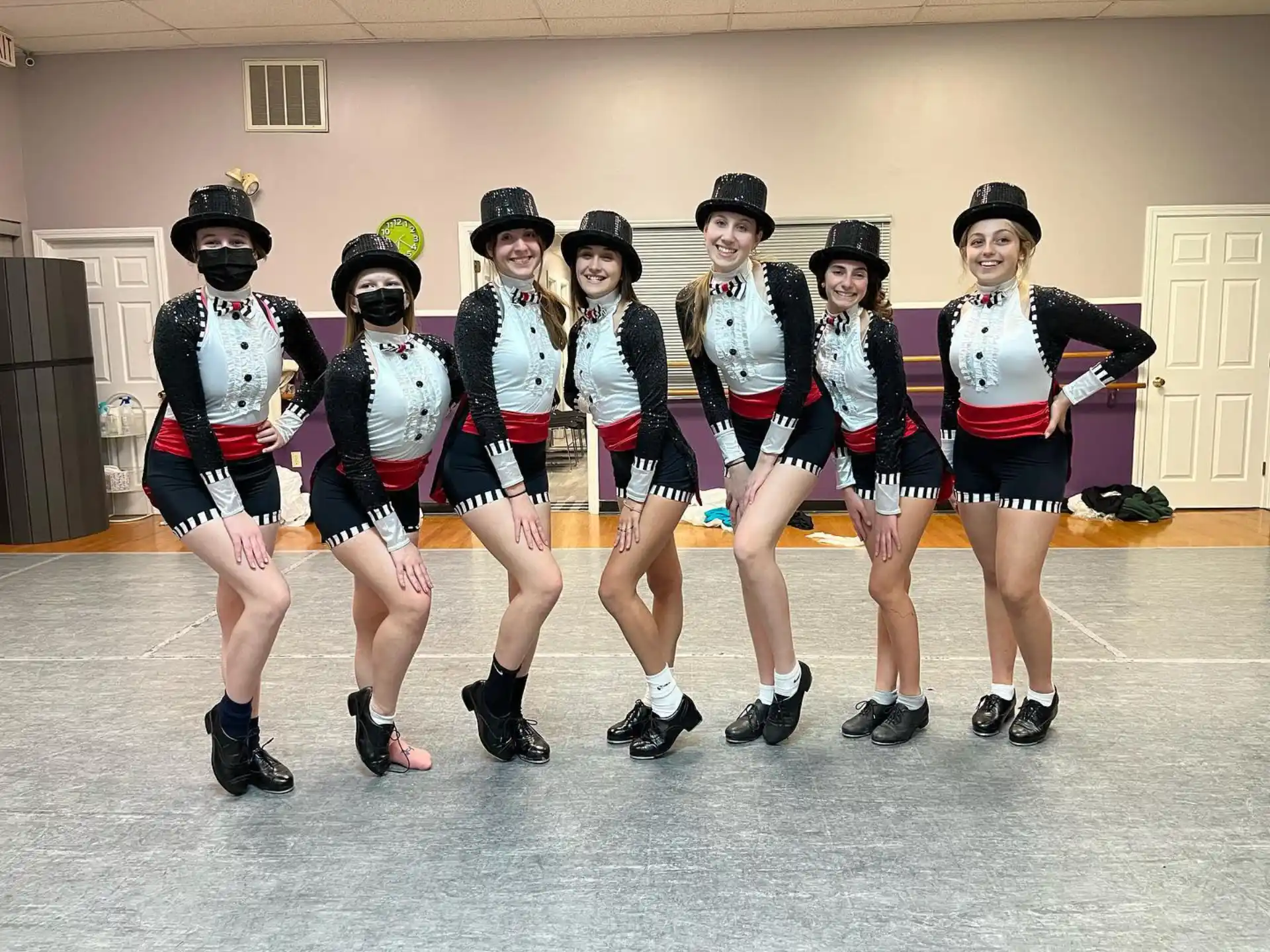 a group of women wearing matching outfits