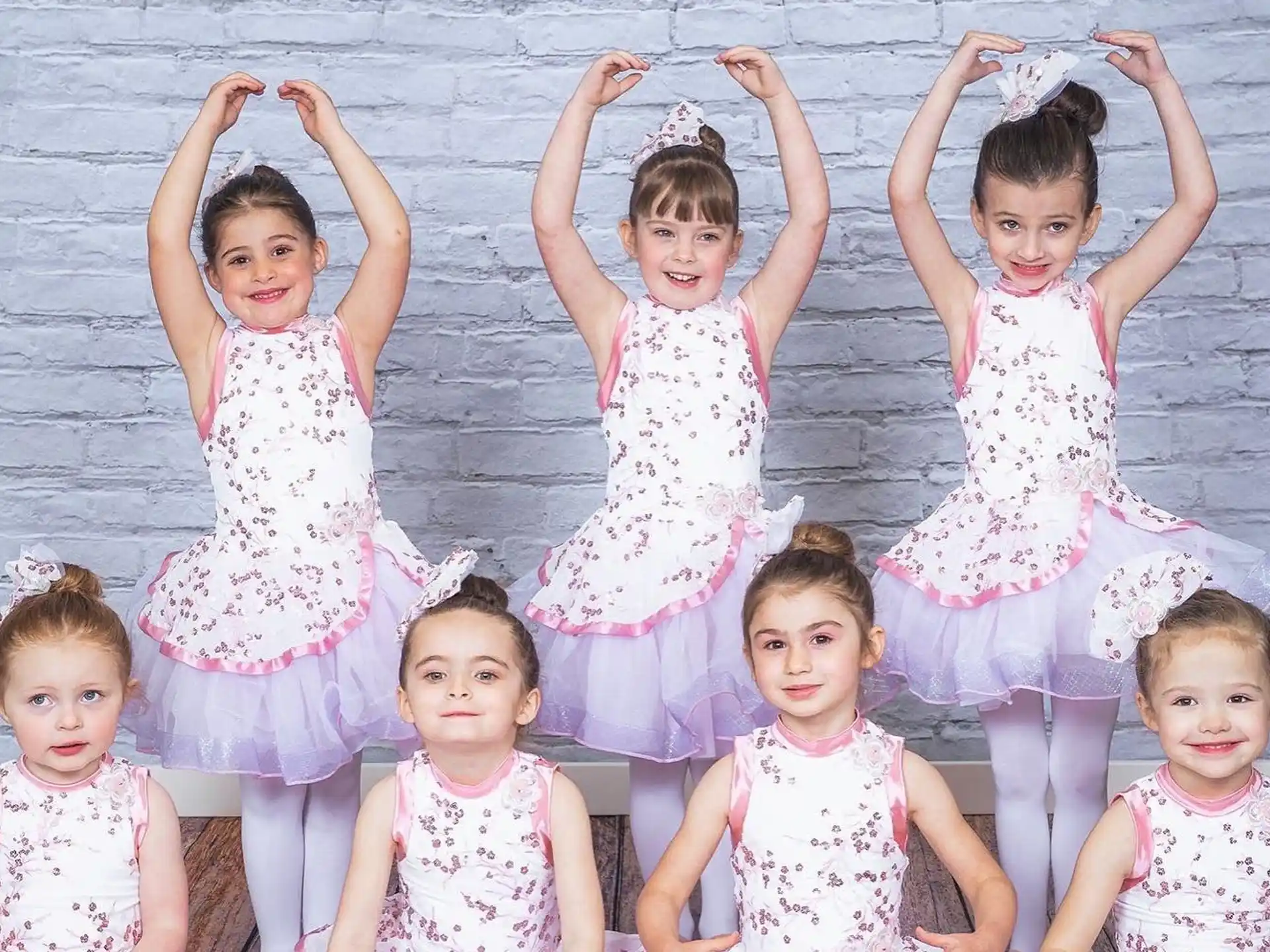 a group of children in dresses