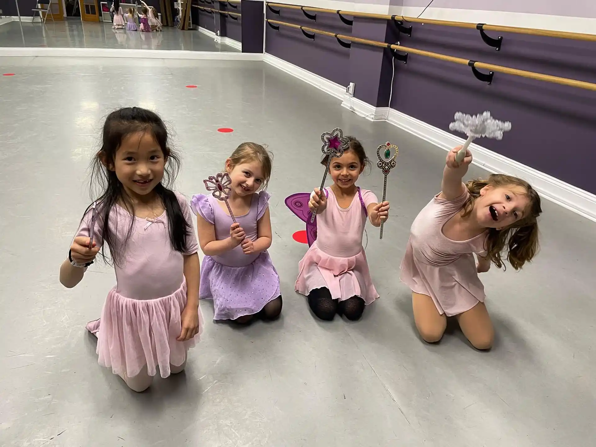 a group of girls in dresses