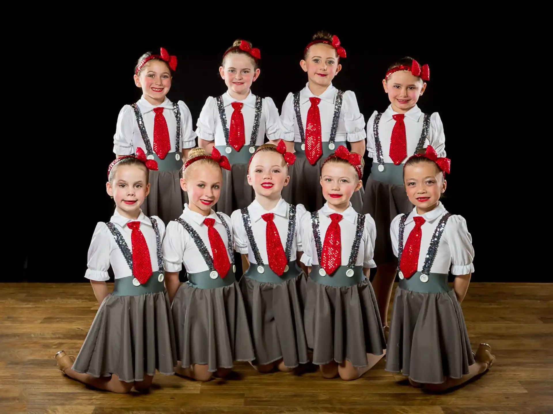 a group of children in school uniforms