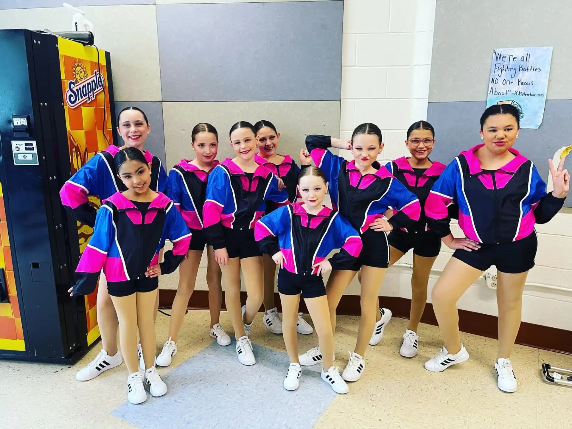 a group of women in matching outfits