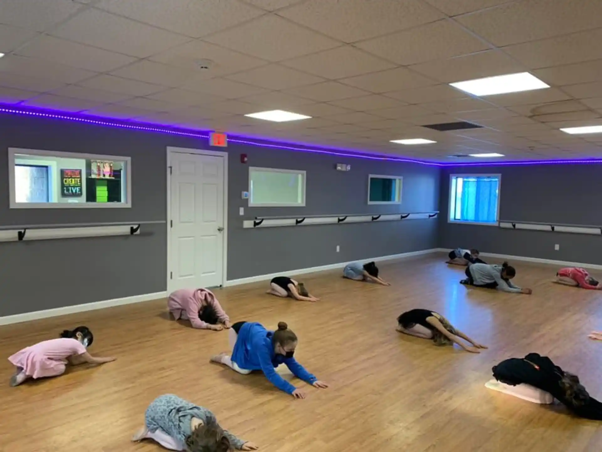 a group of people doing yoga