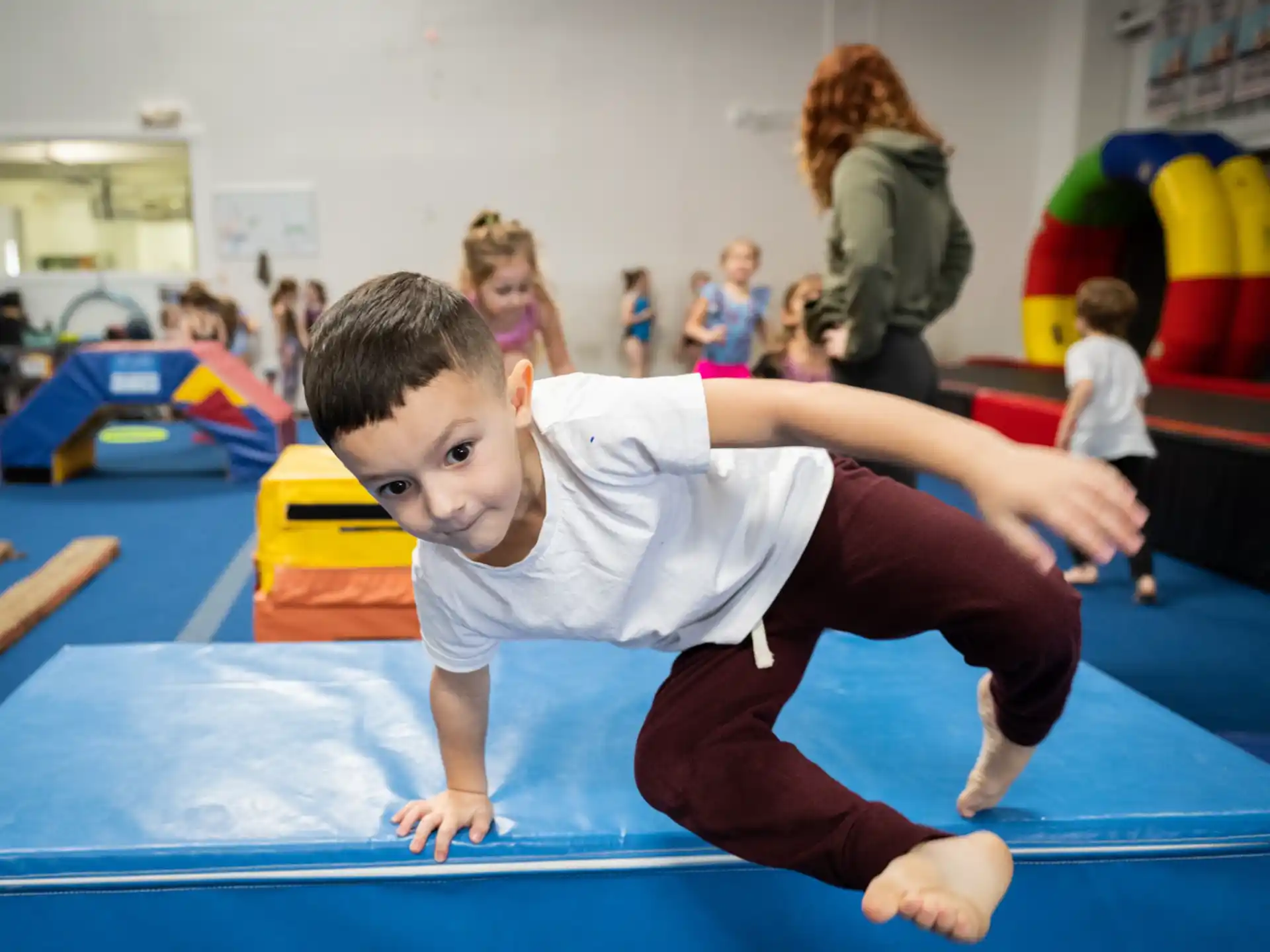 a boy doing a yoga pose