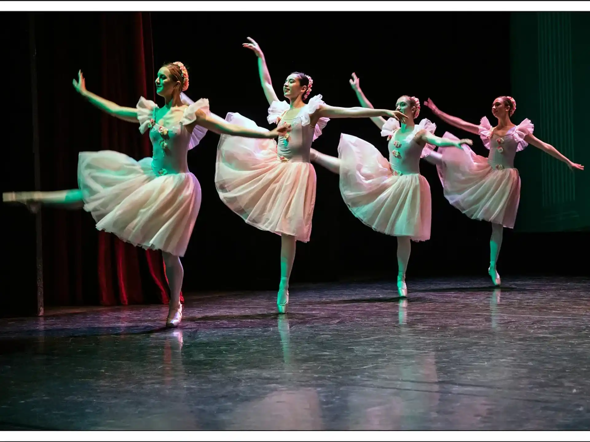 a group of women dancing on a stage