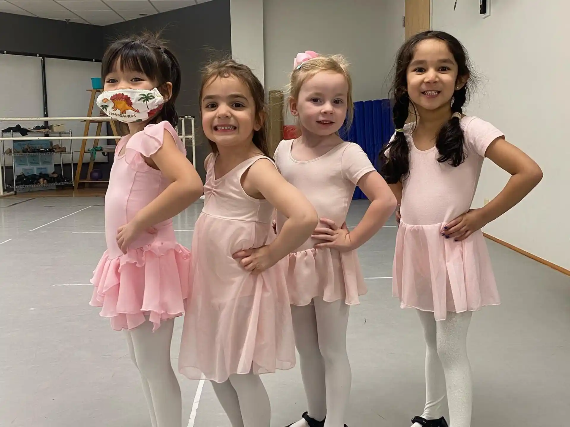a group of girls in dresses