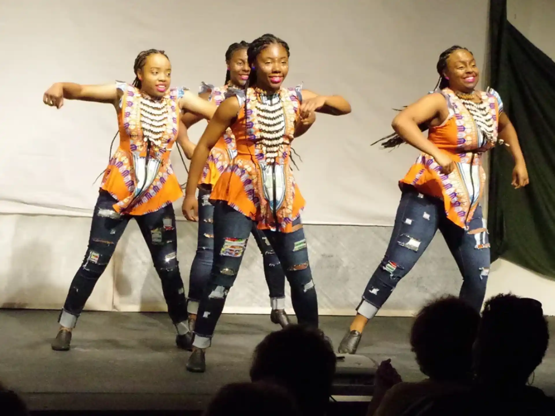 a group of women dancing on a stage