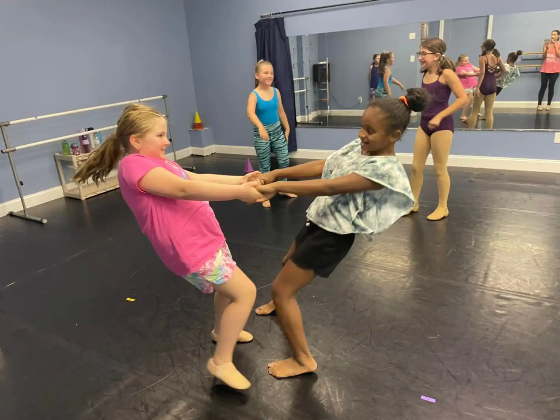 a couple of girls dancing