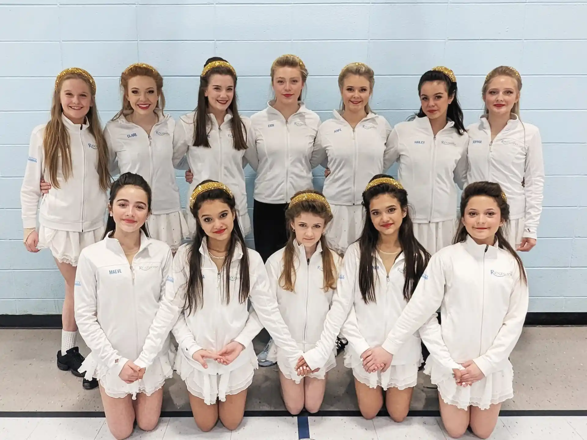 a group of people wearing white shirts