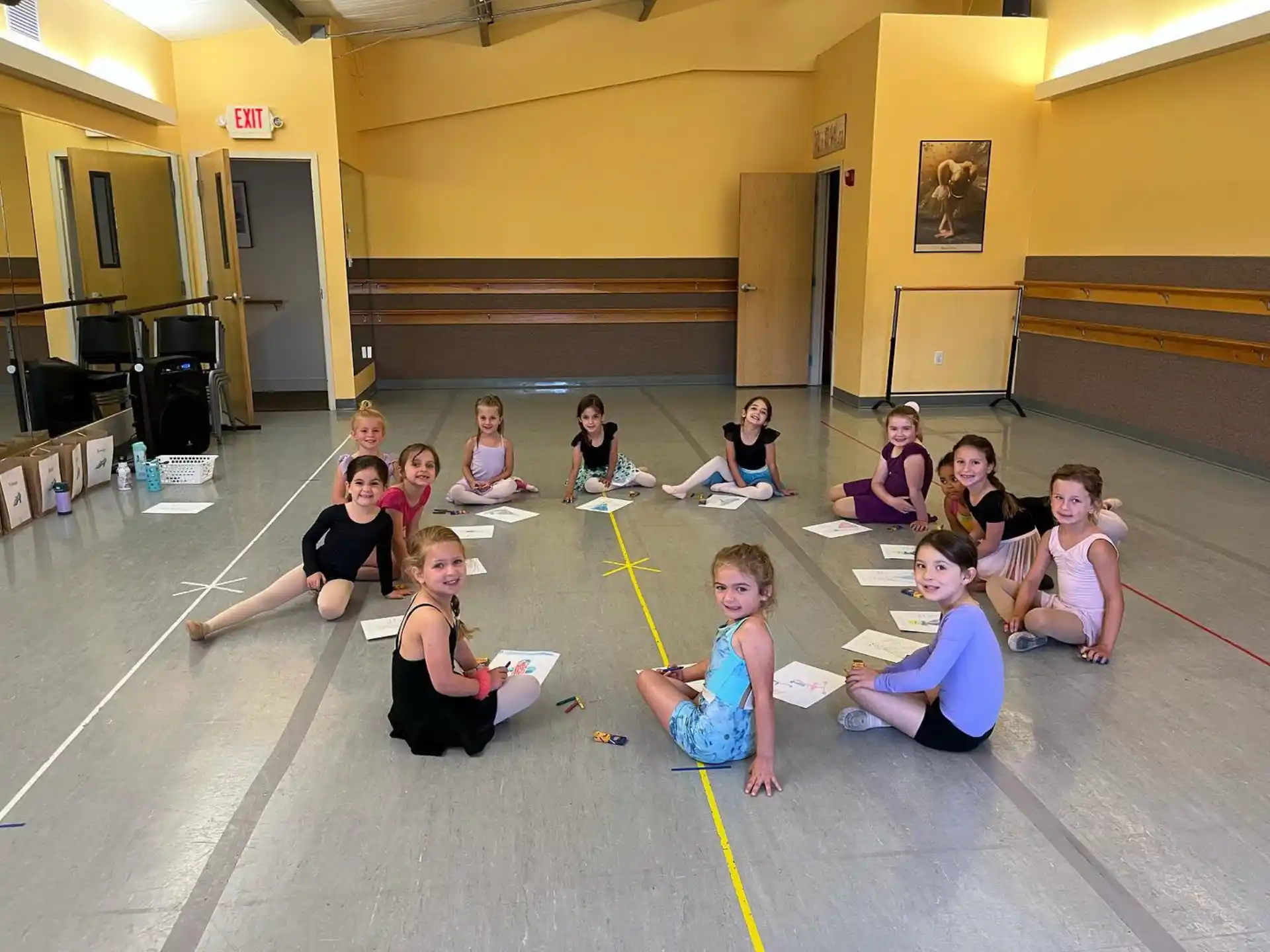 a group of people sitting on the floor