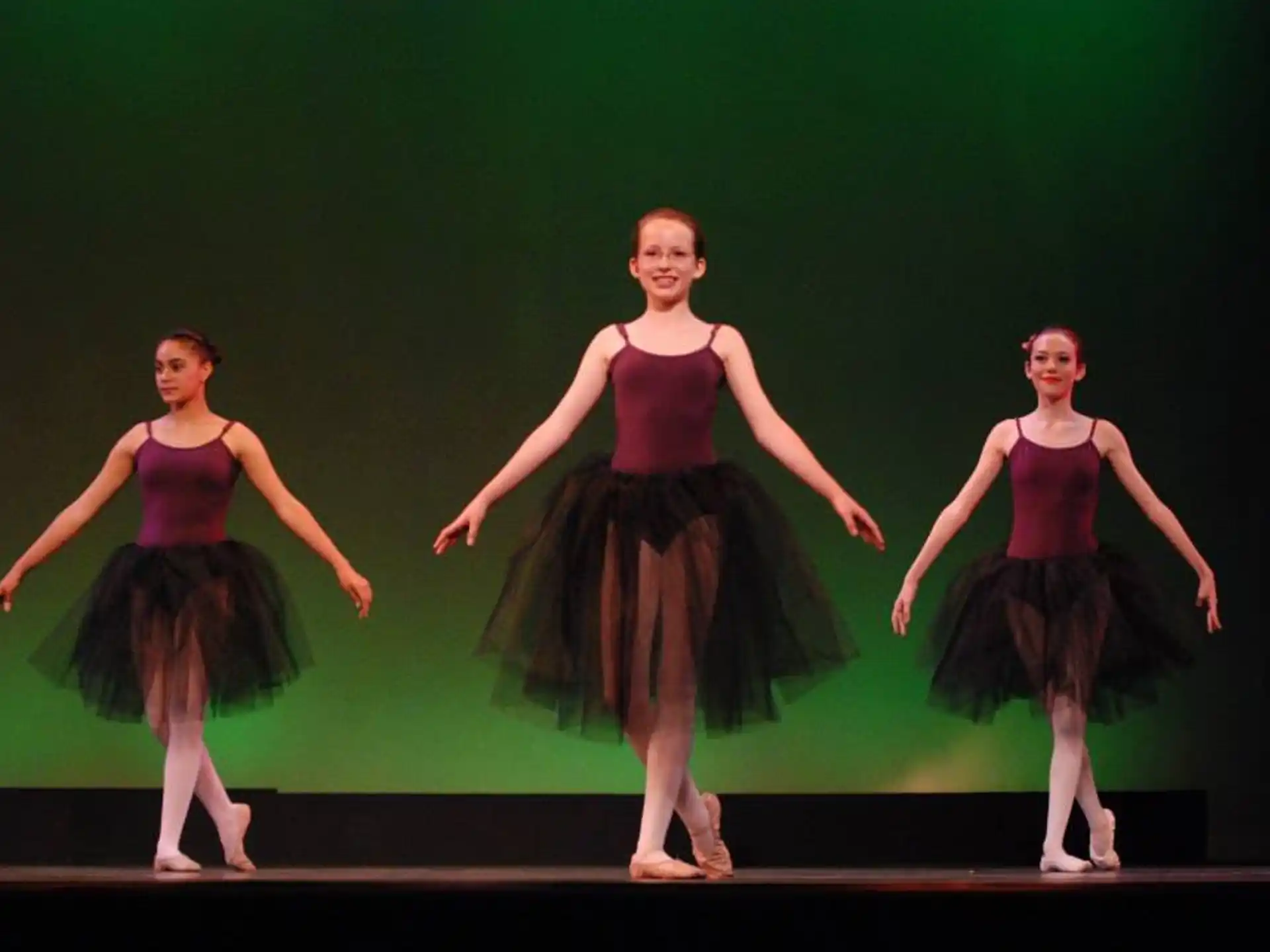 a group of women dancing on a stage