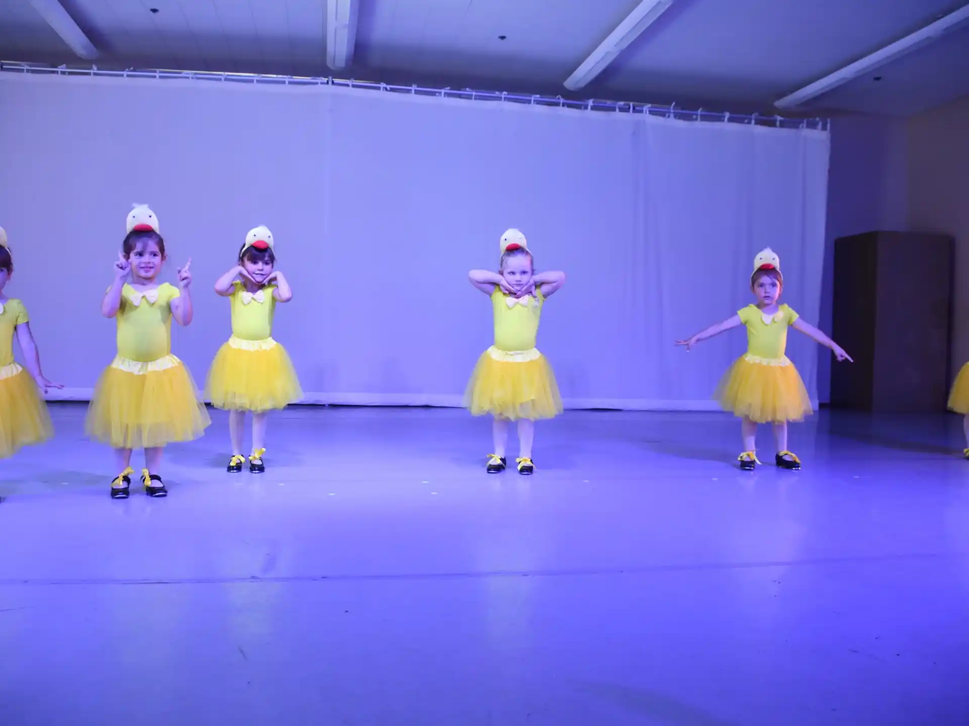 a group of girls in clothing on a stage