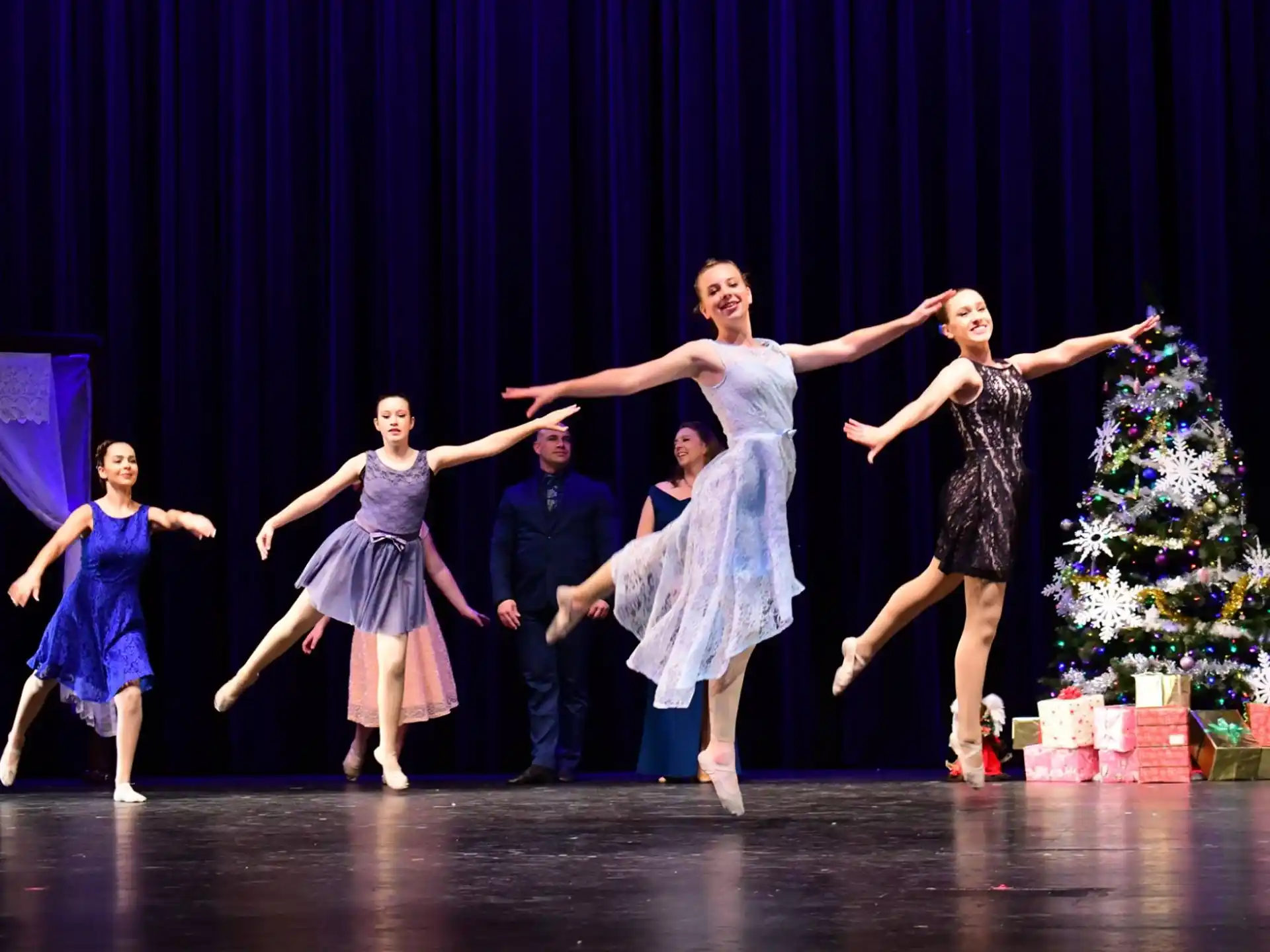 a group of people dancing on a stage