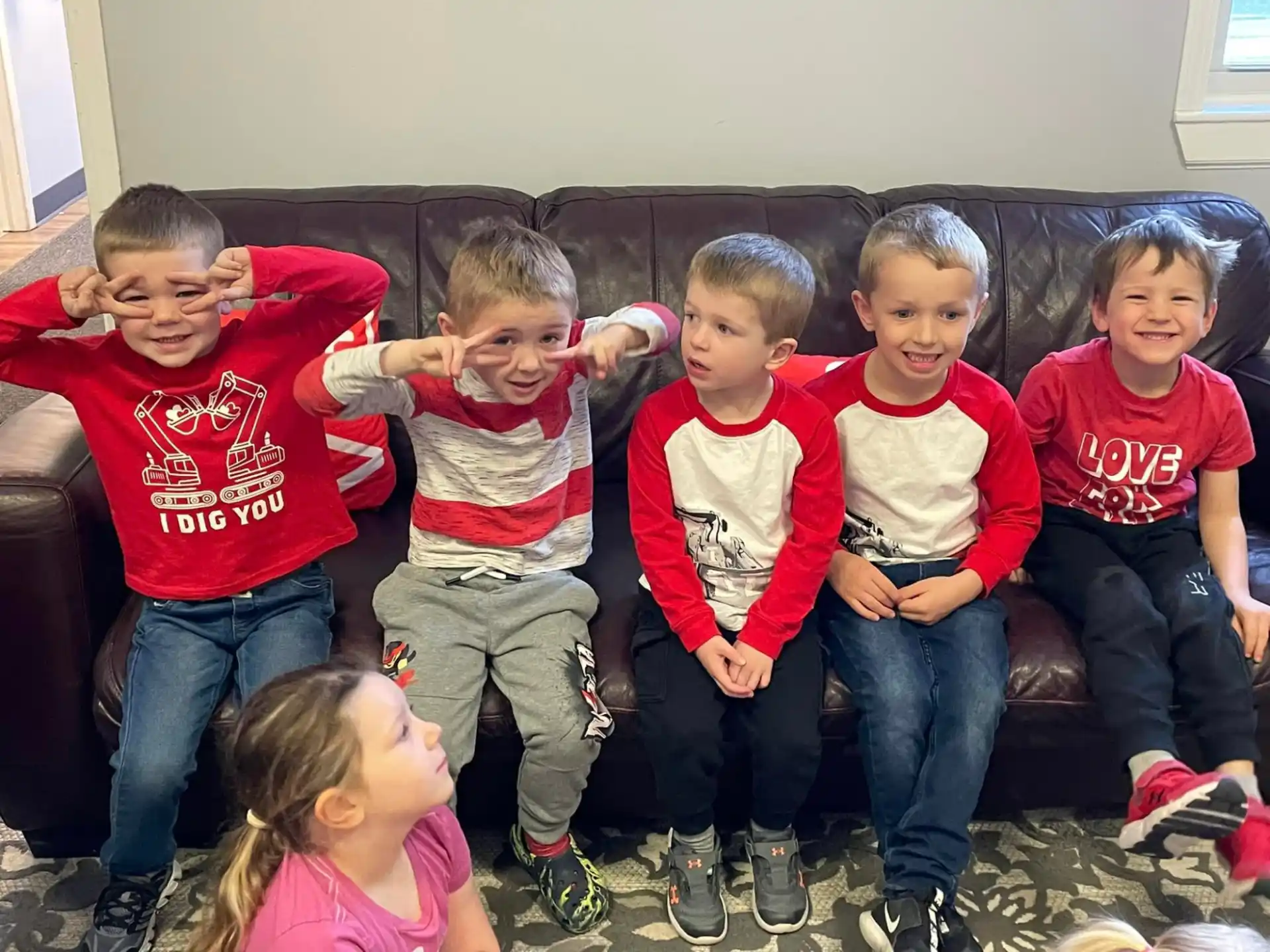 a group of children sitting on a couch