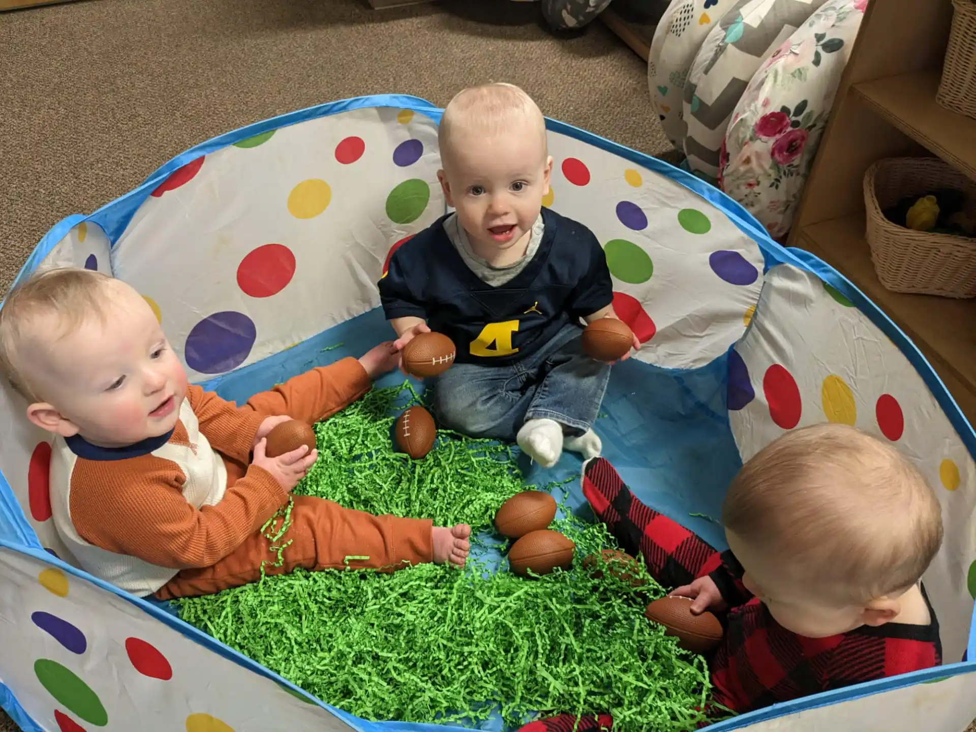 babies sitting on a blanket