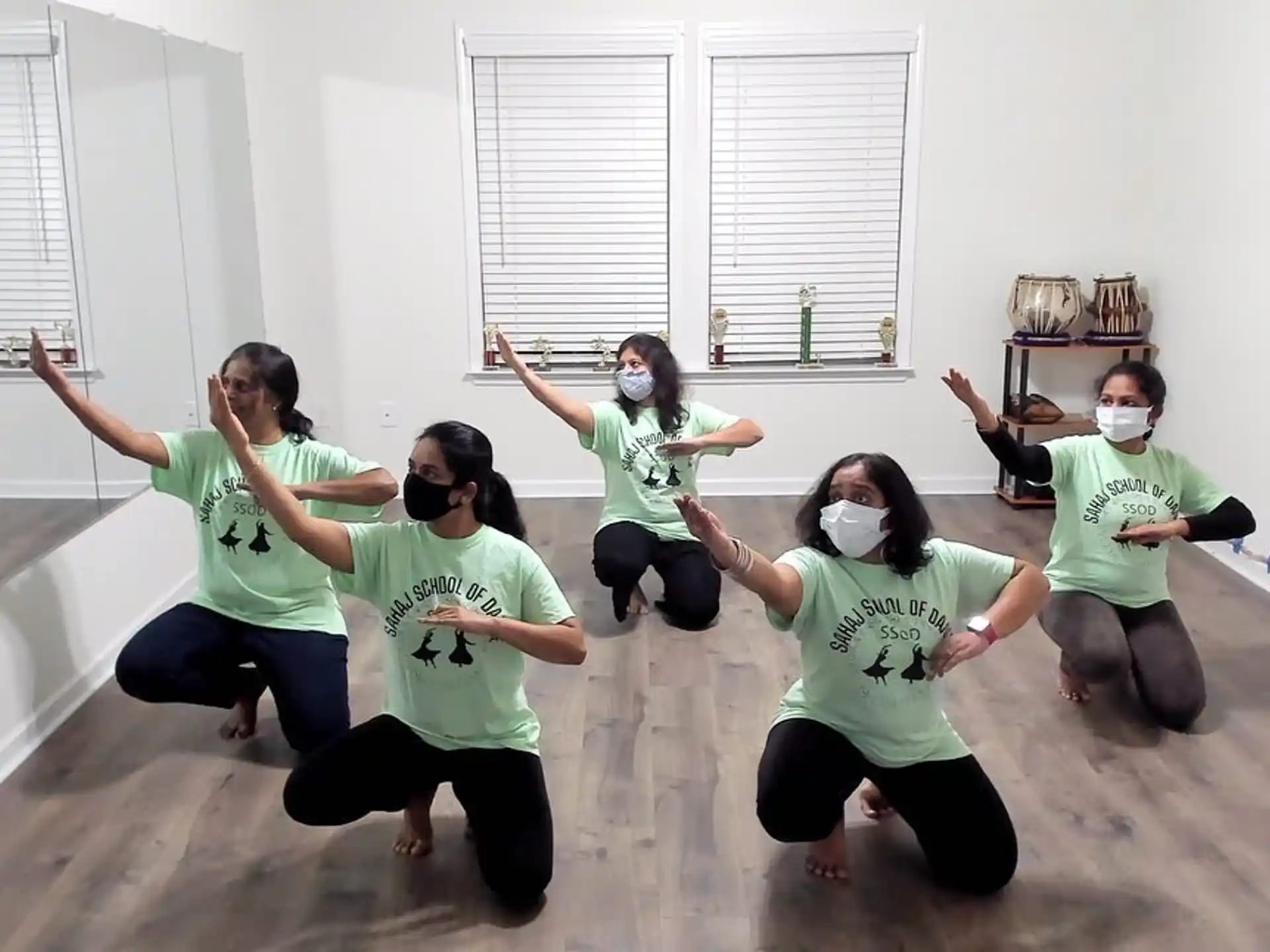 a group of people wearing masks