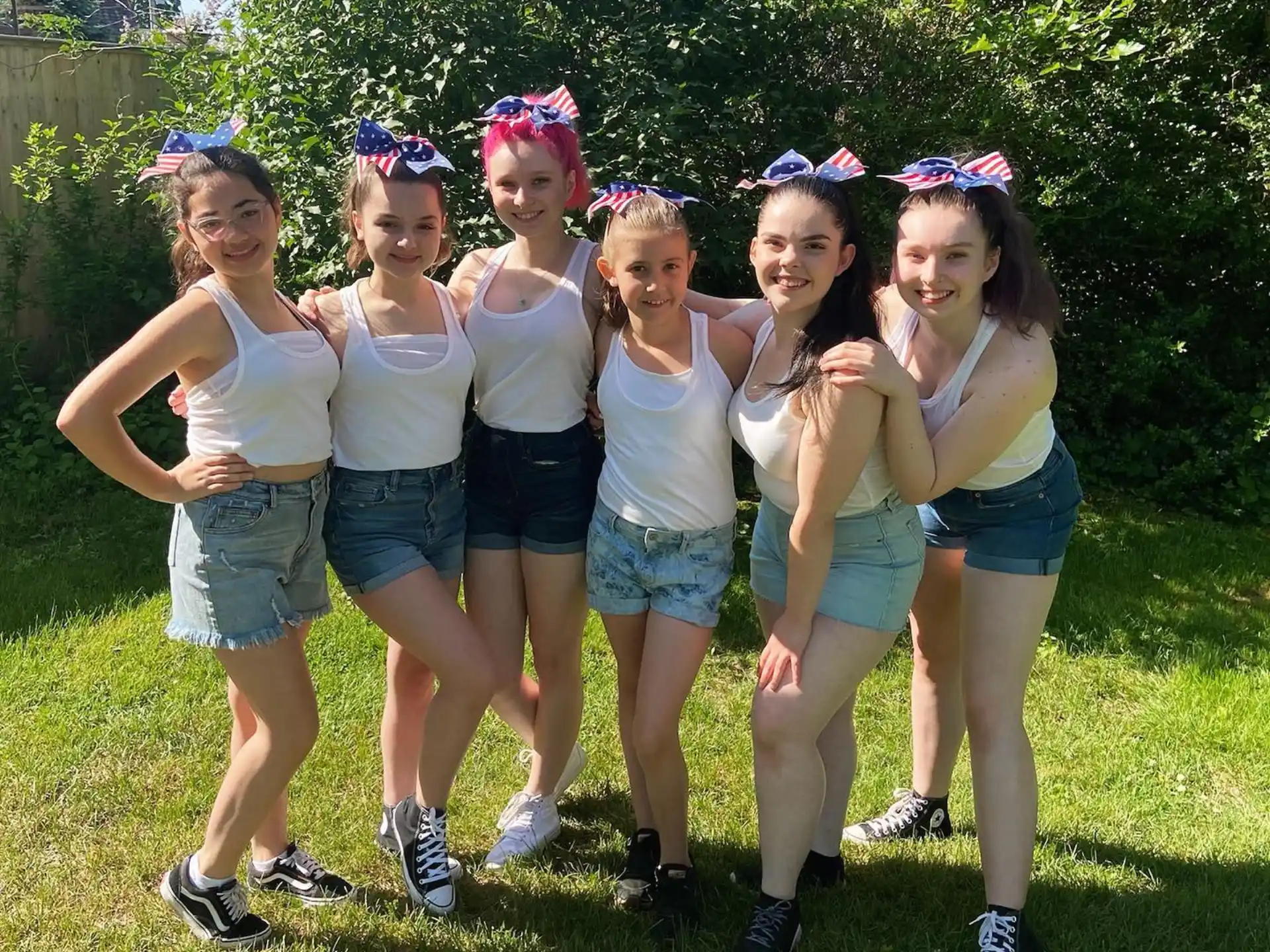 a group of girls posing for a picture