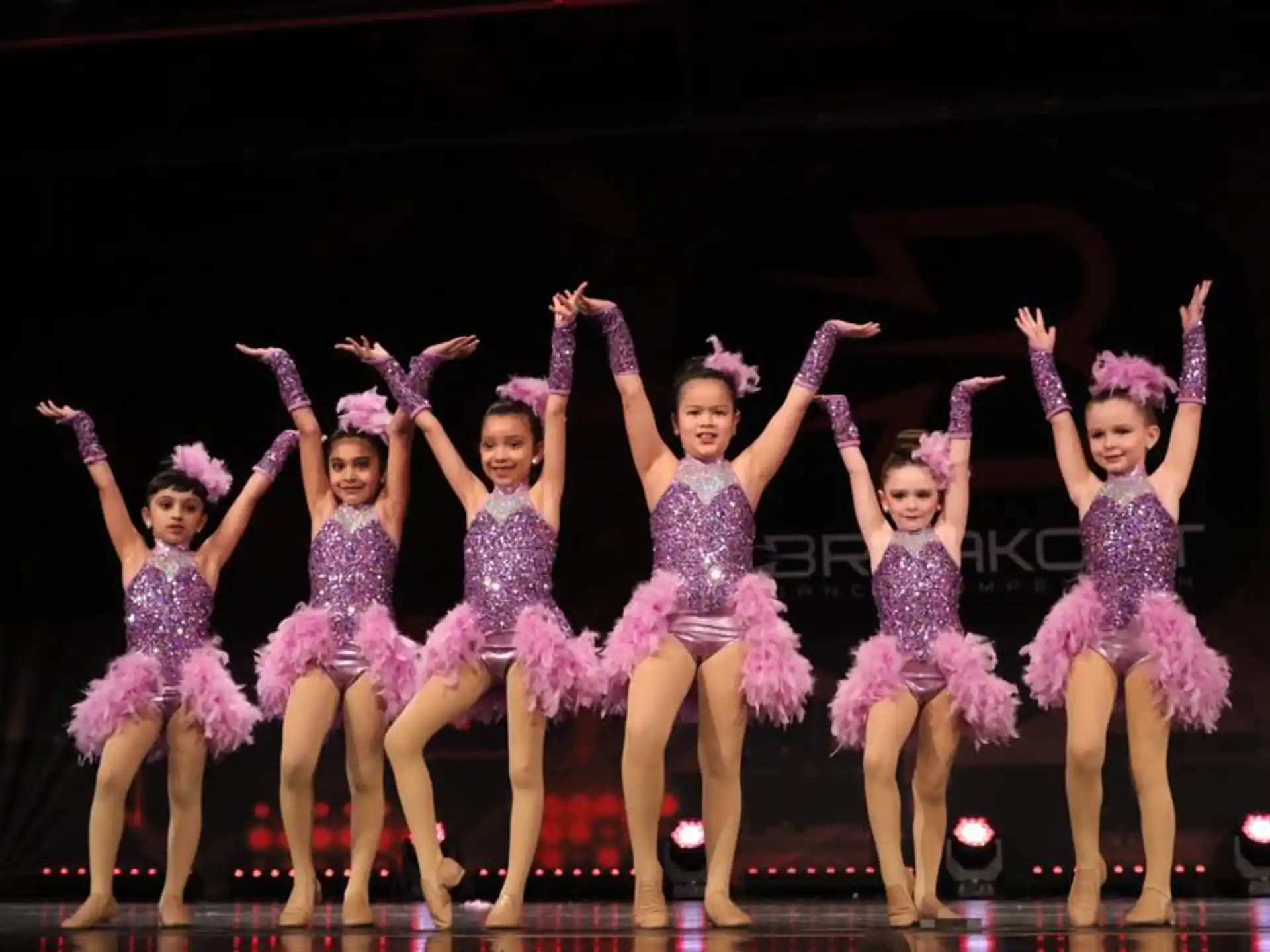 a group of women dancing on a stage