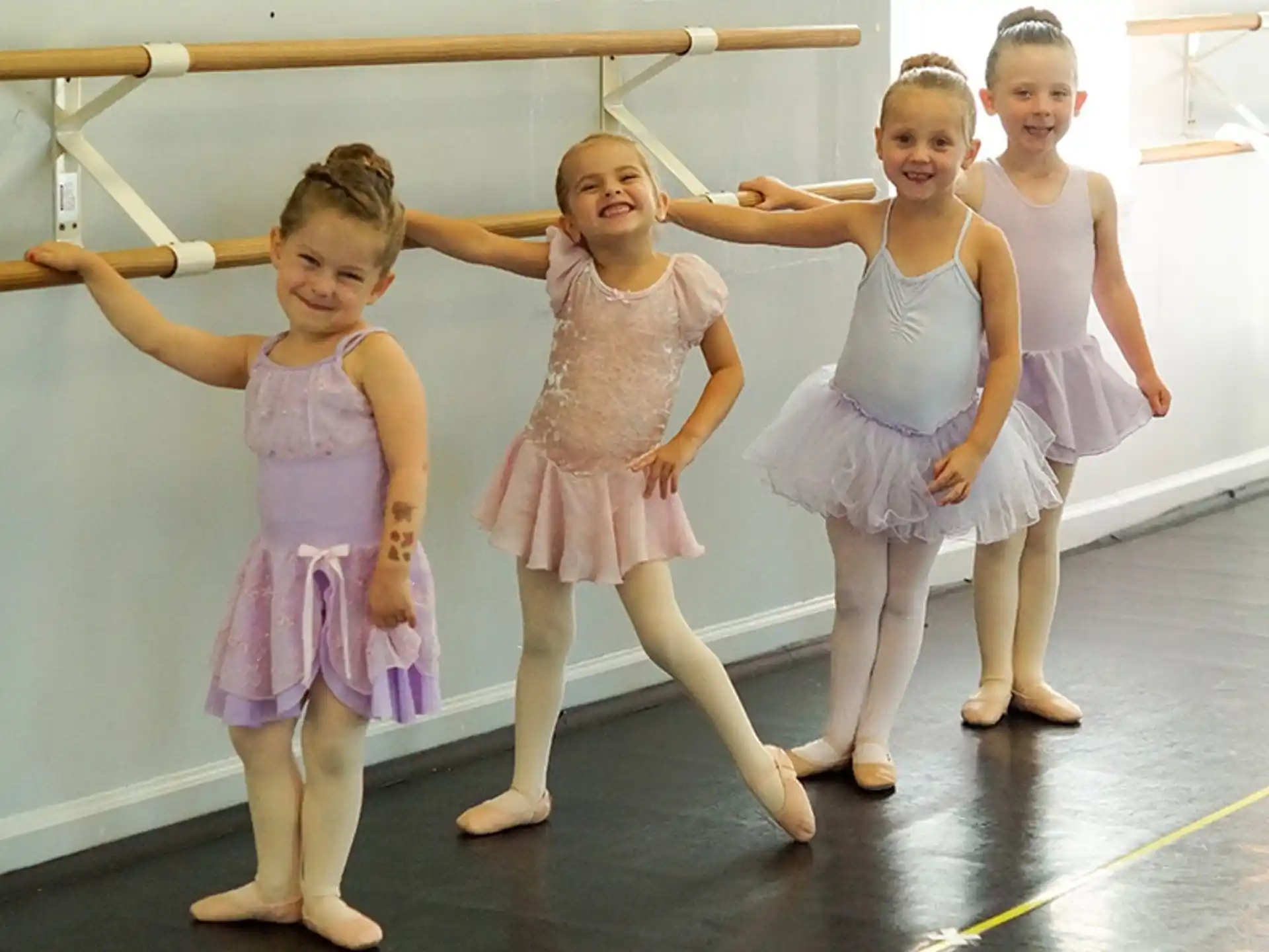a group of girls in dresses
