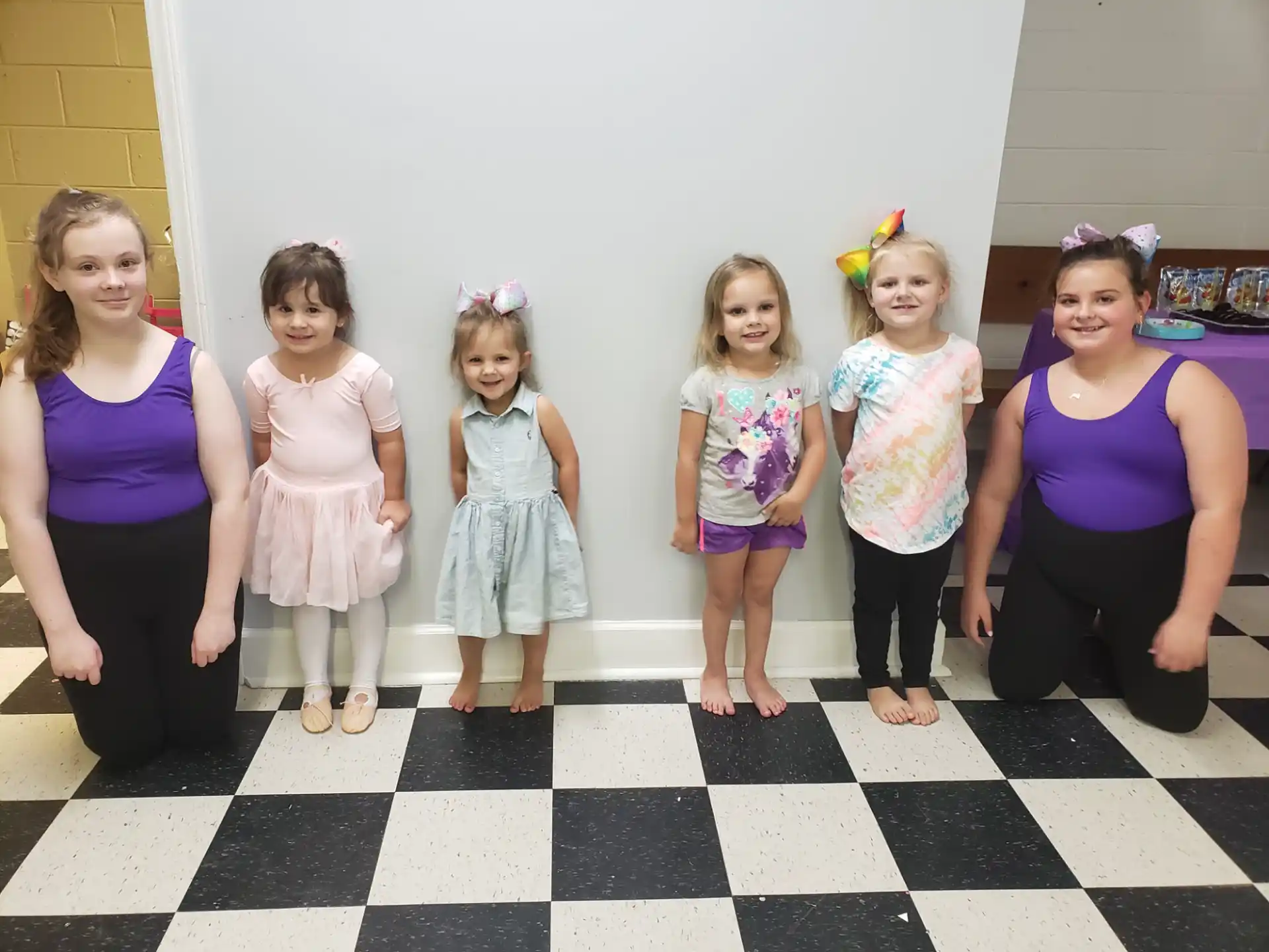 a group of girls posing for a photo