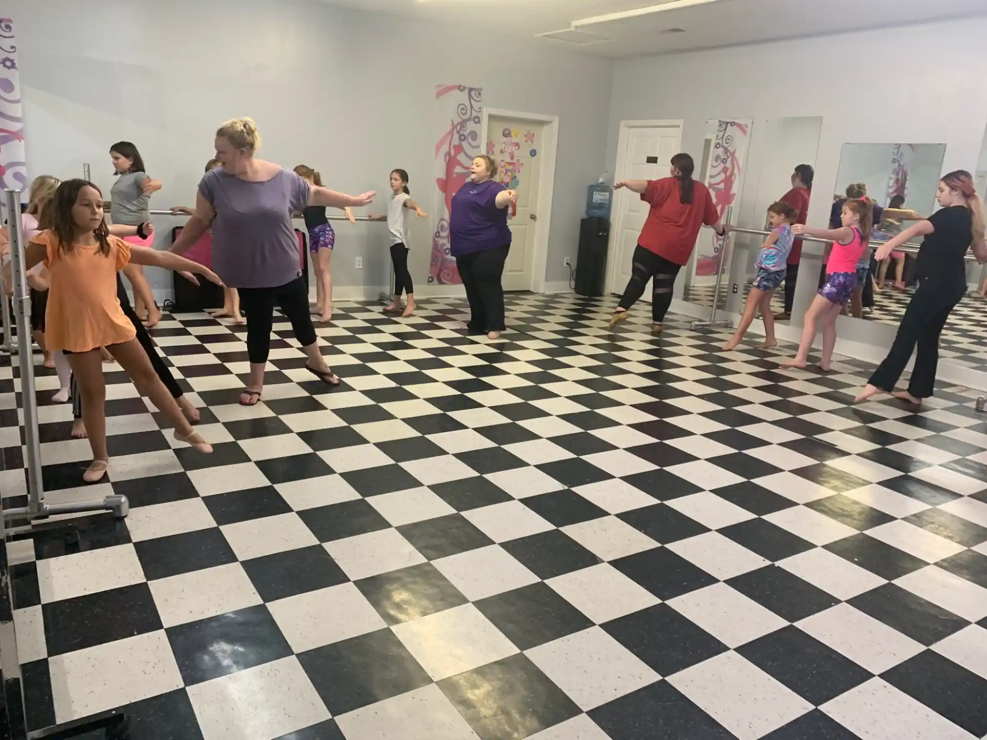a group of people dancing in a room