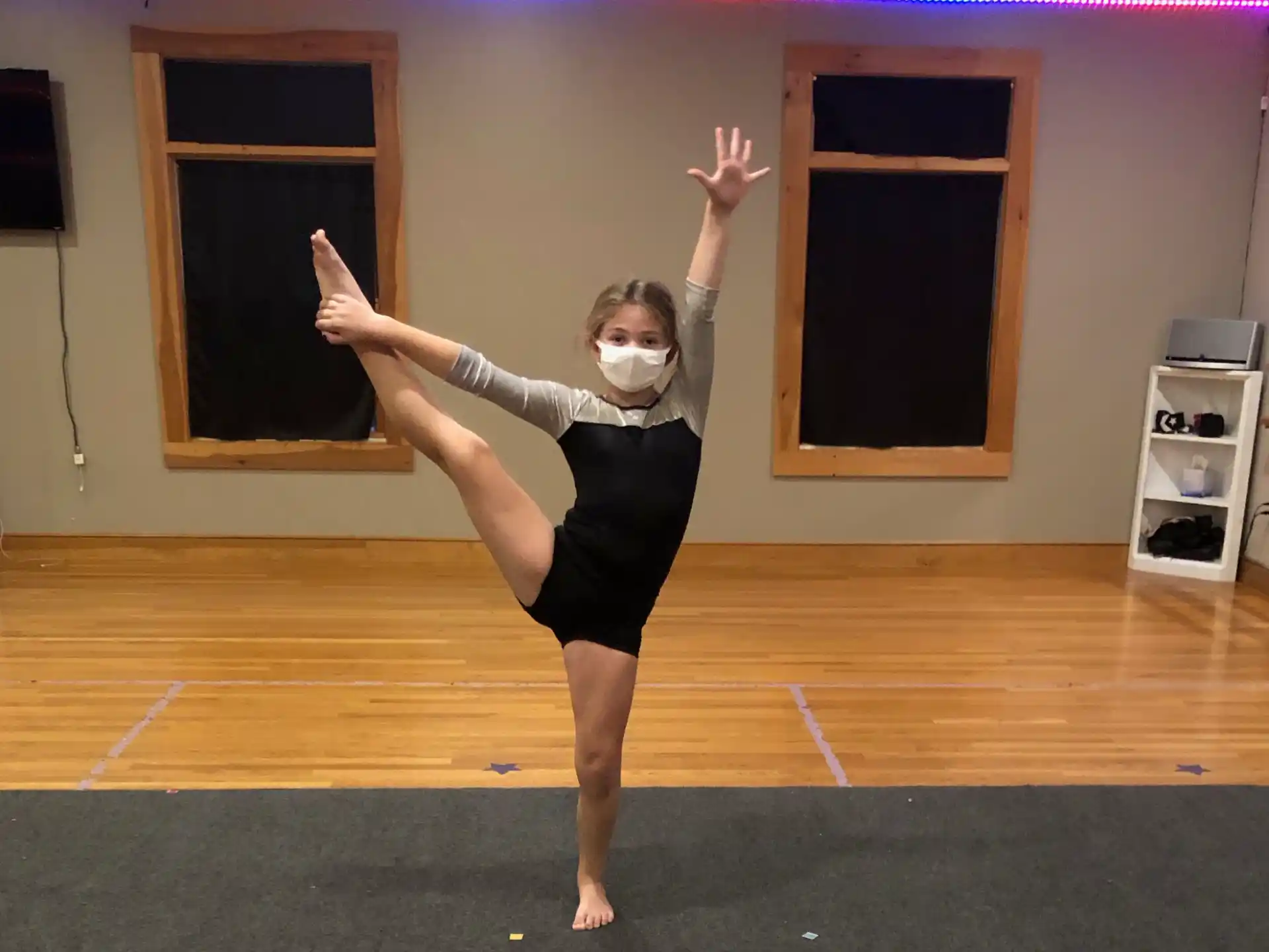 a person dancing on a wood floor