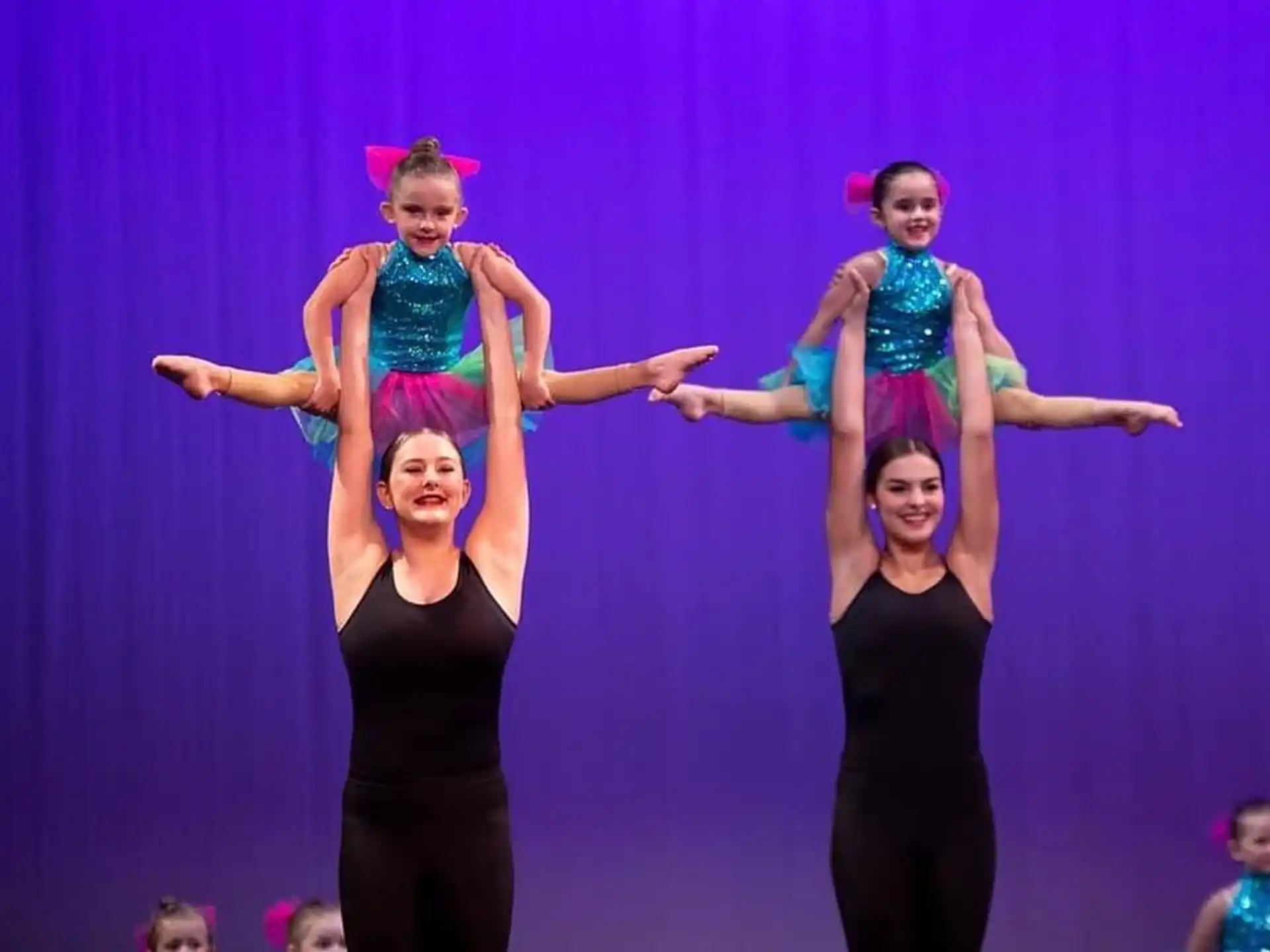 a group of women performing on stage