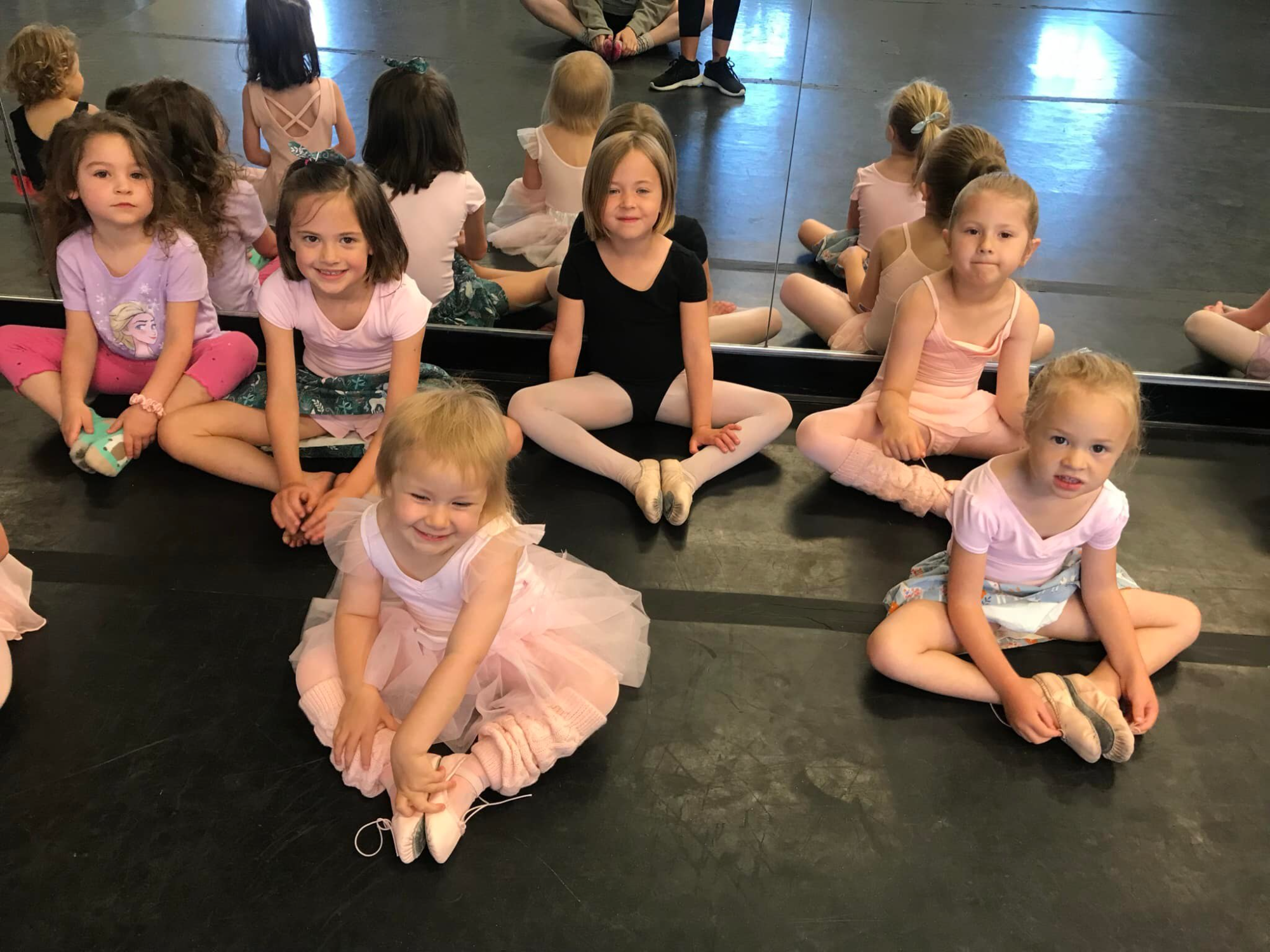 a group of children sitting on the floor