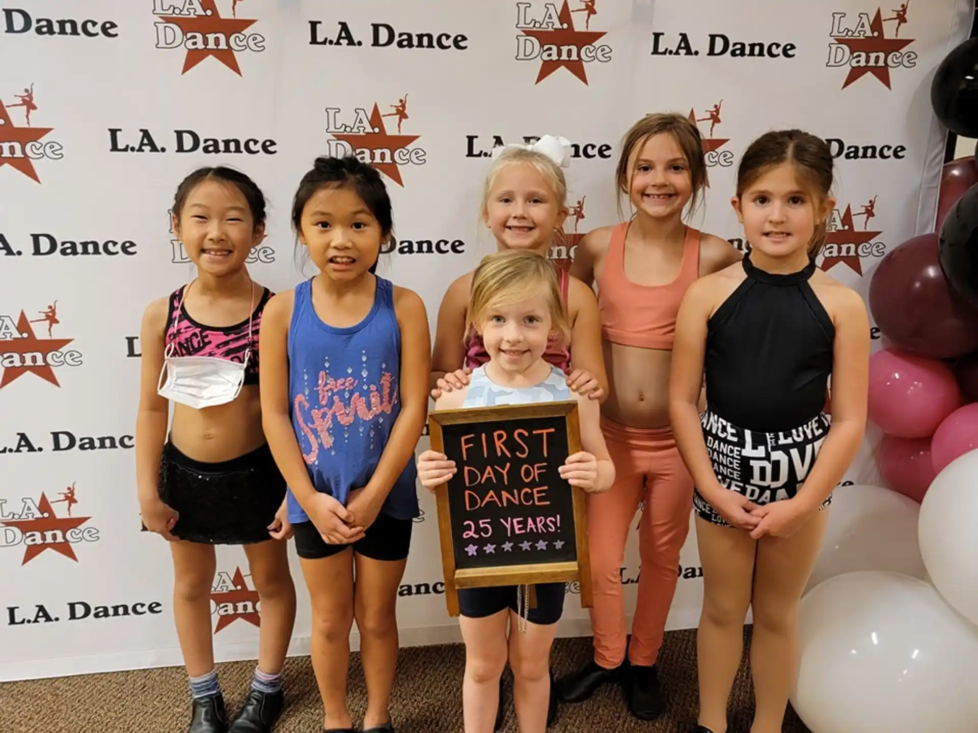 a group of girls posing for a picture