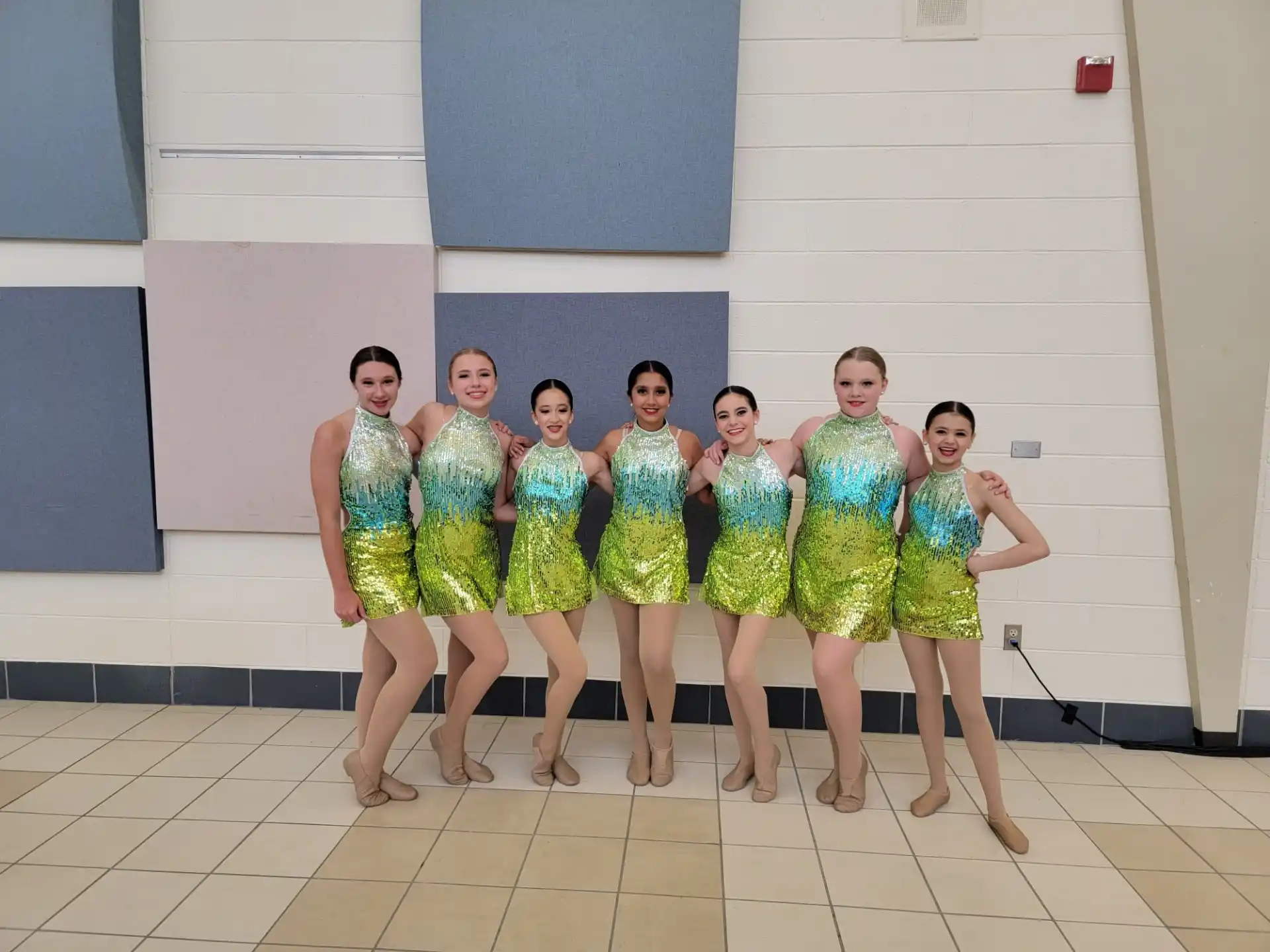 a group of women in matching dresses