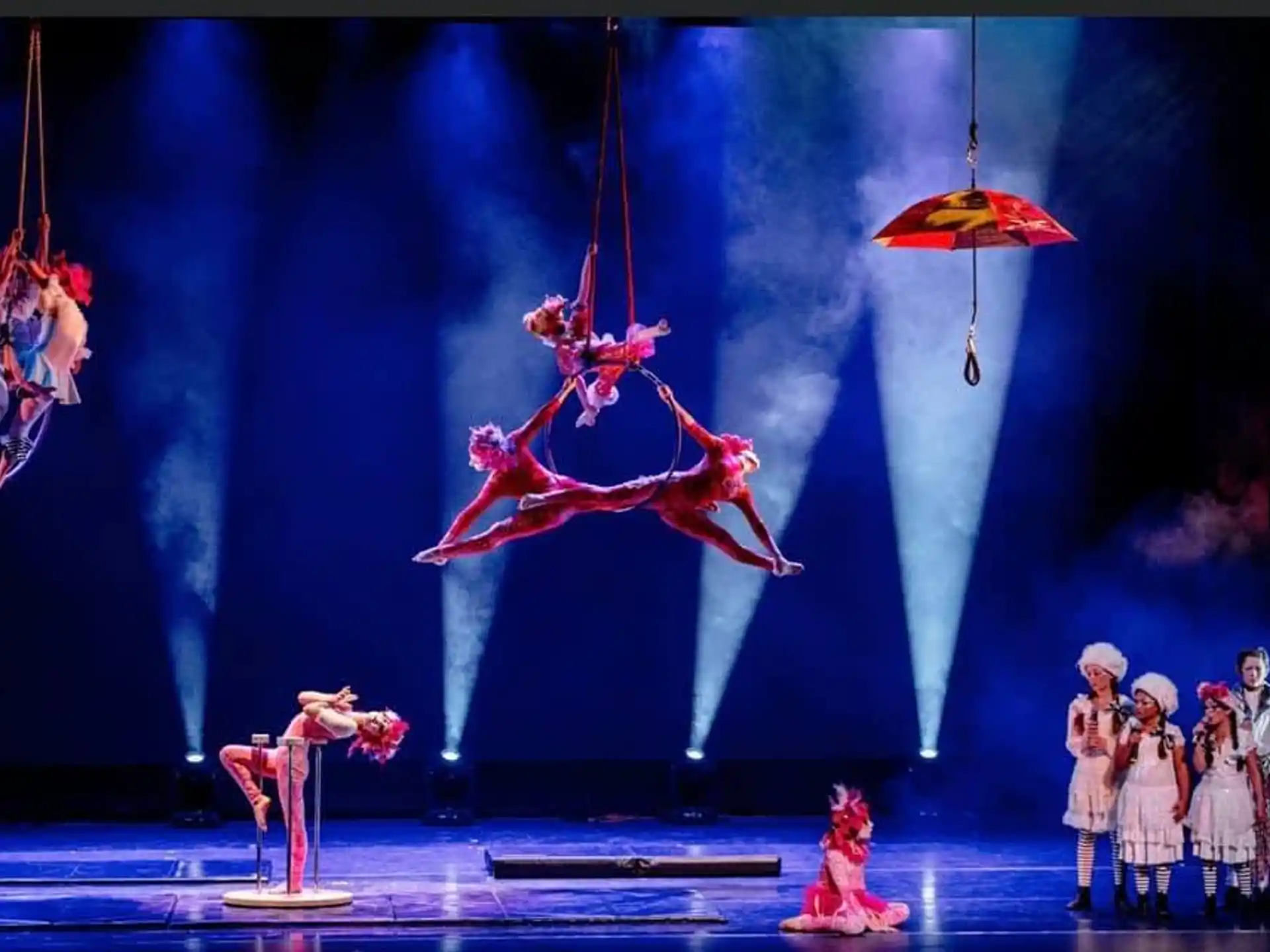 a group of people performing on stage