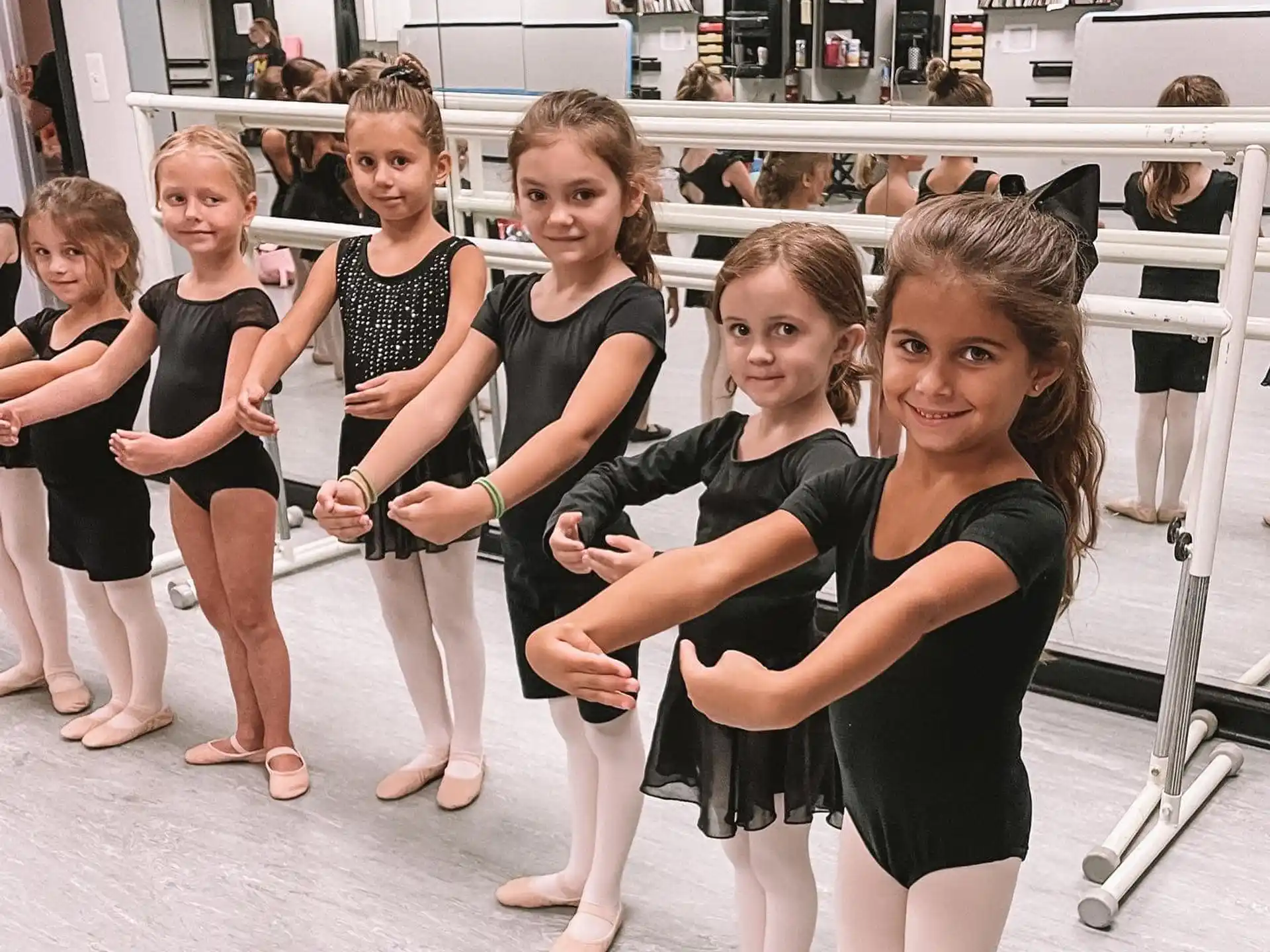 a group of girls posing for a photo