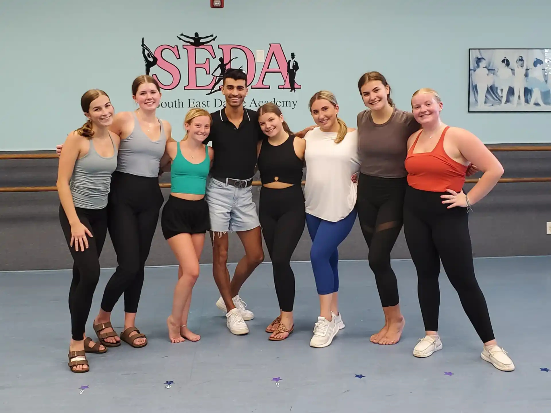a group of women posing for a photo
