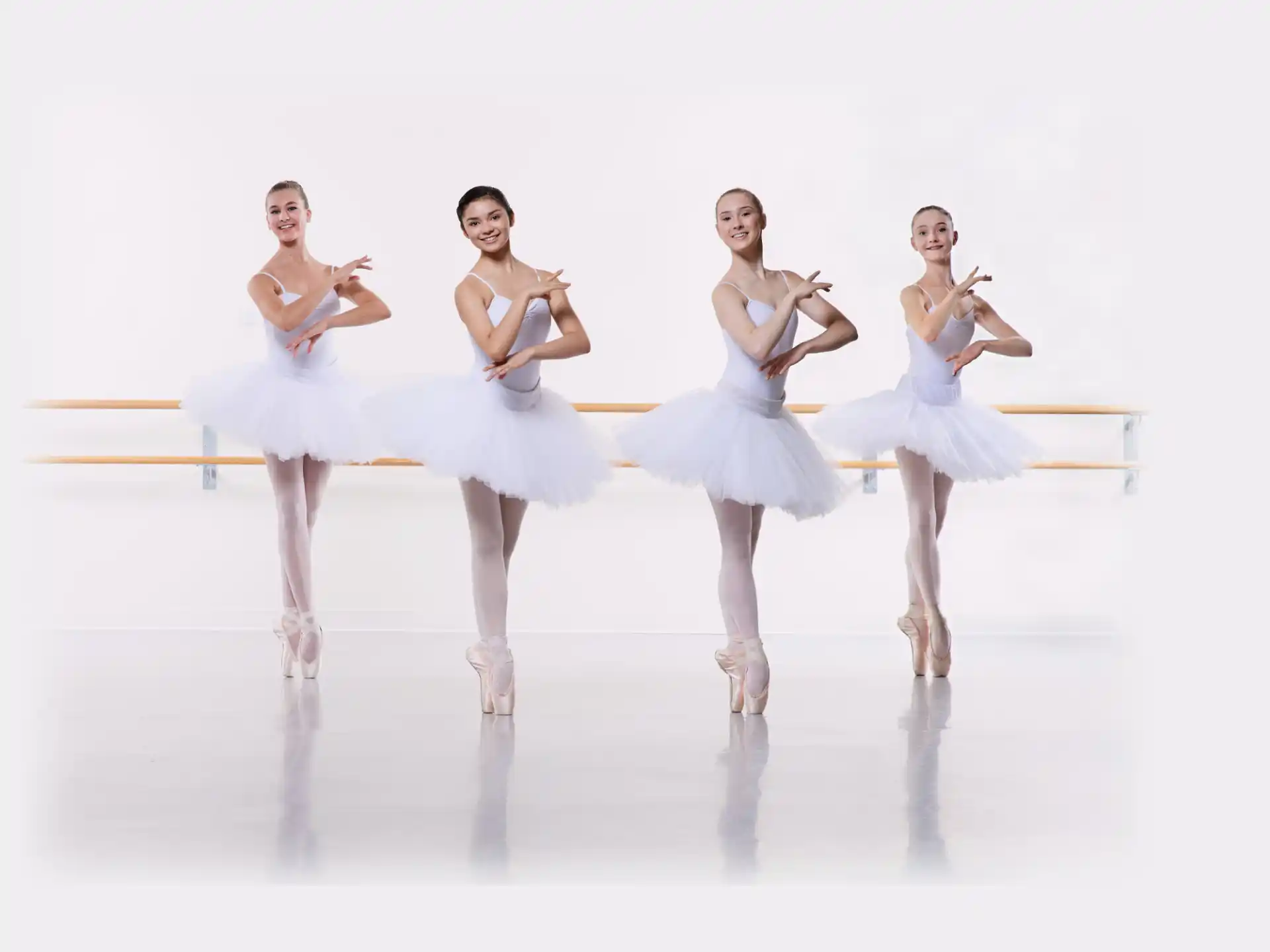 a group of women in white dresses