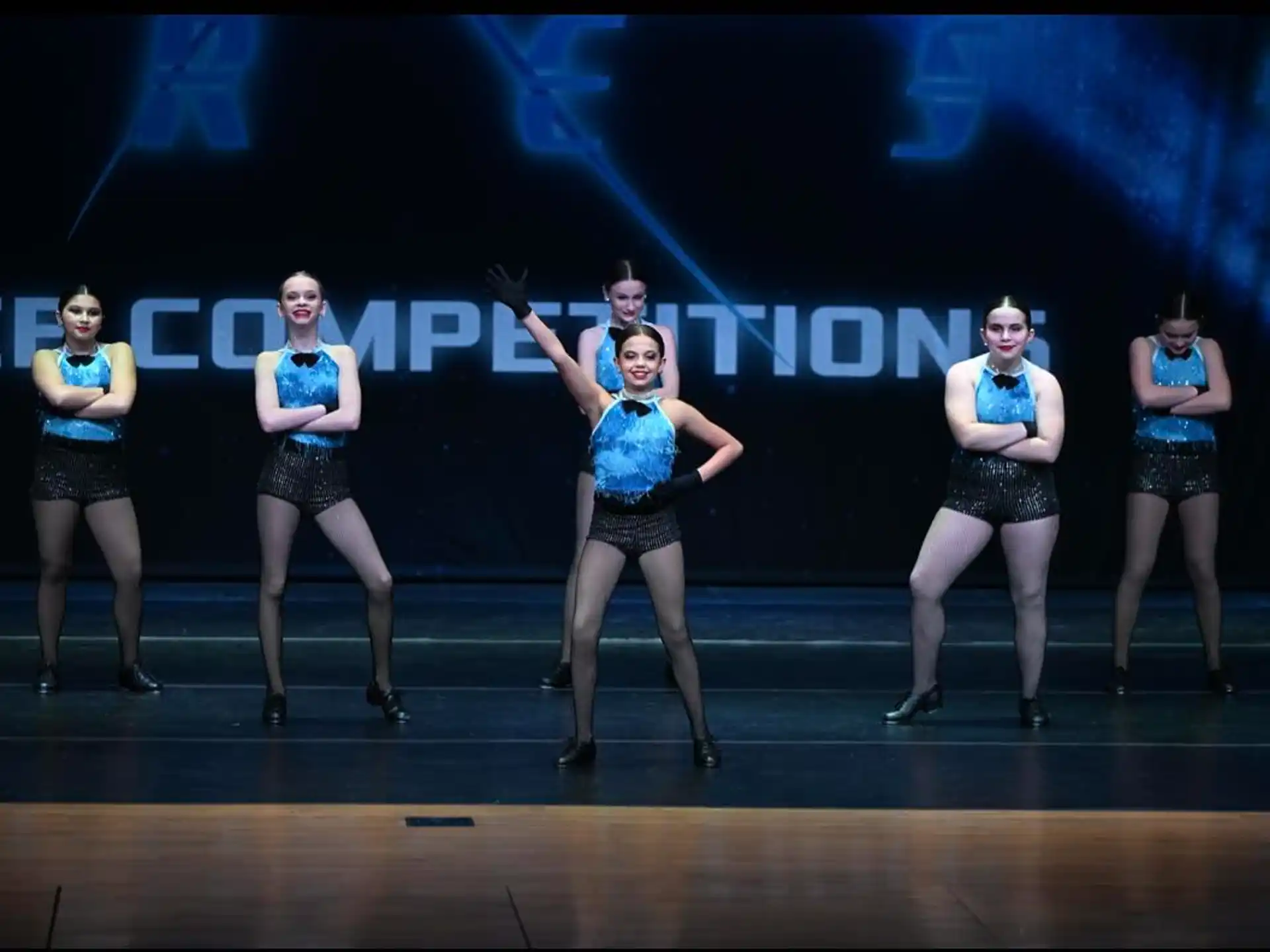 a group of women dancing on a stage
