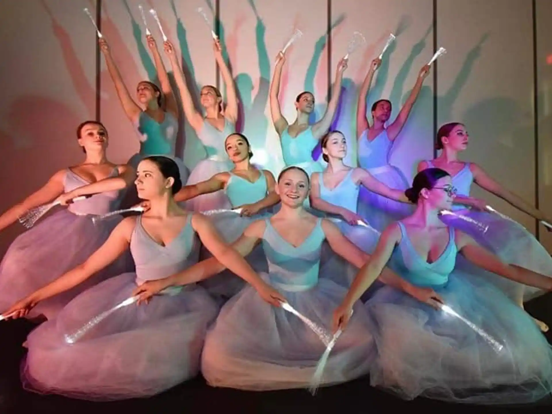 a group of women in dresses dancing