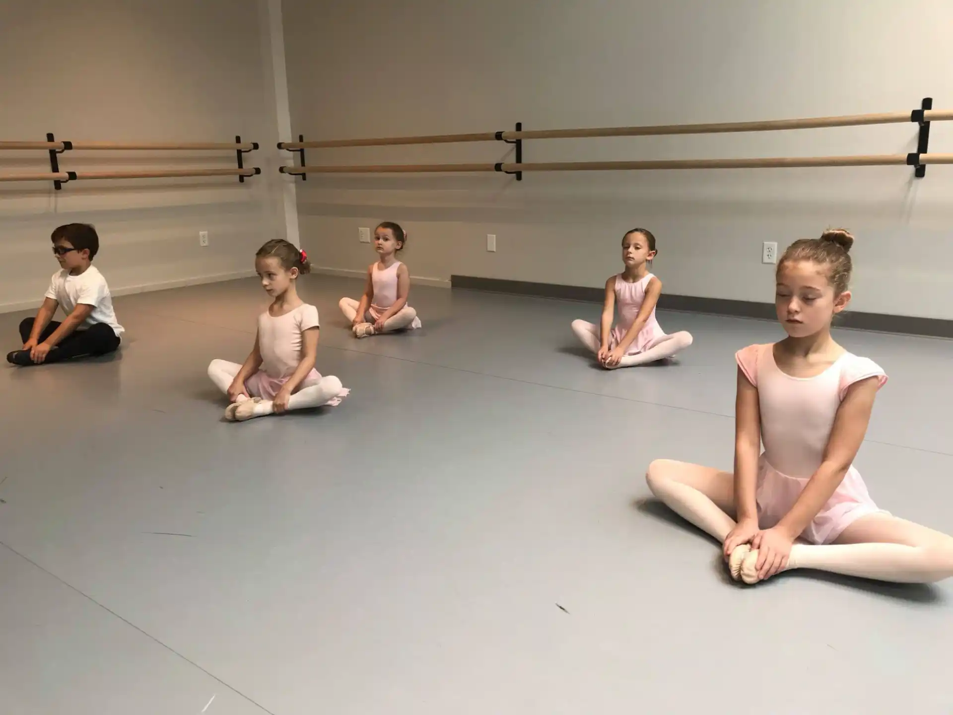 a group of people sitting on the floor