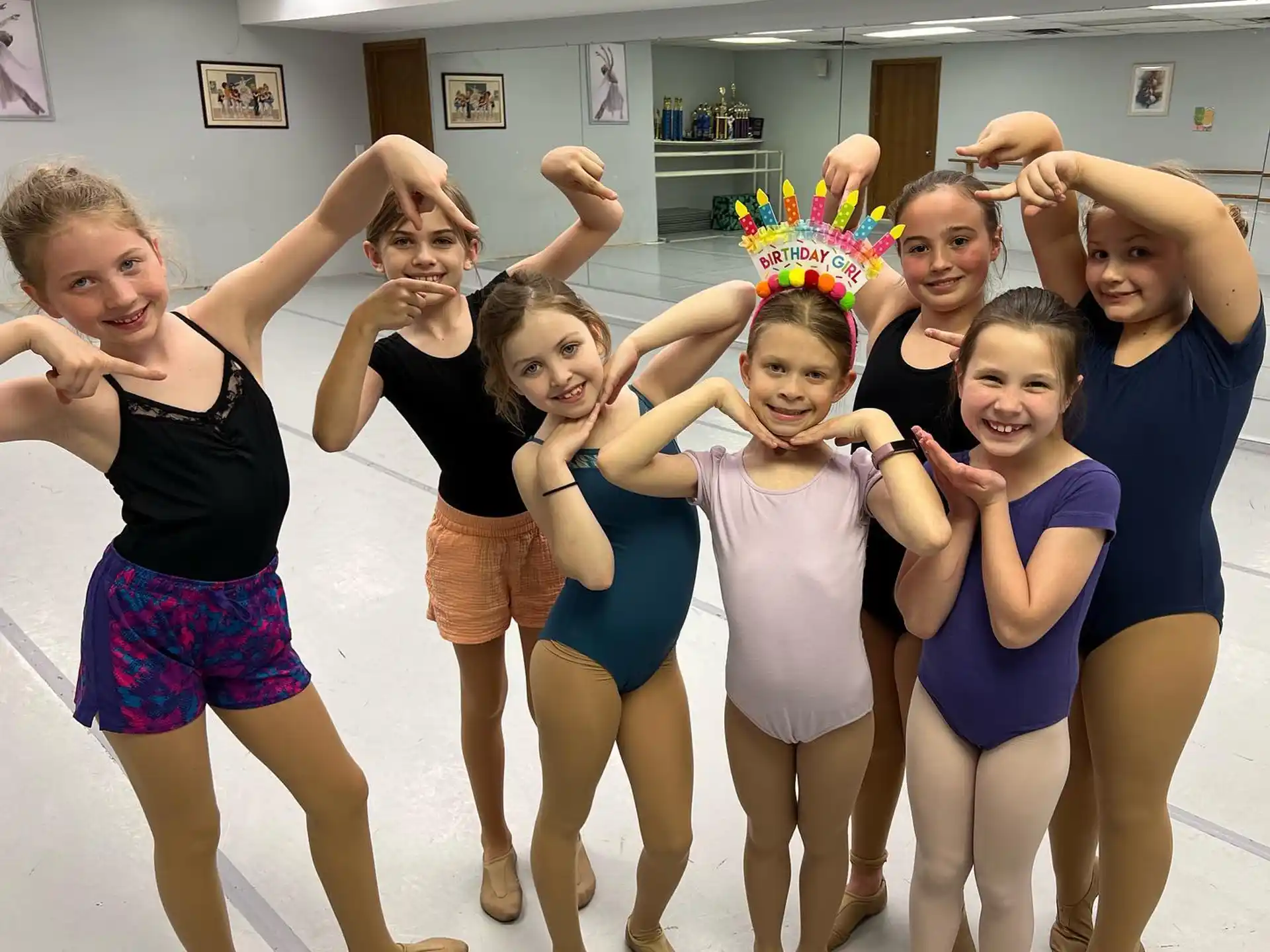 a group of girls posing for a photo