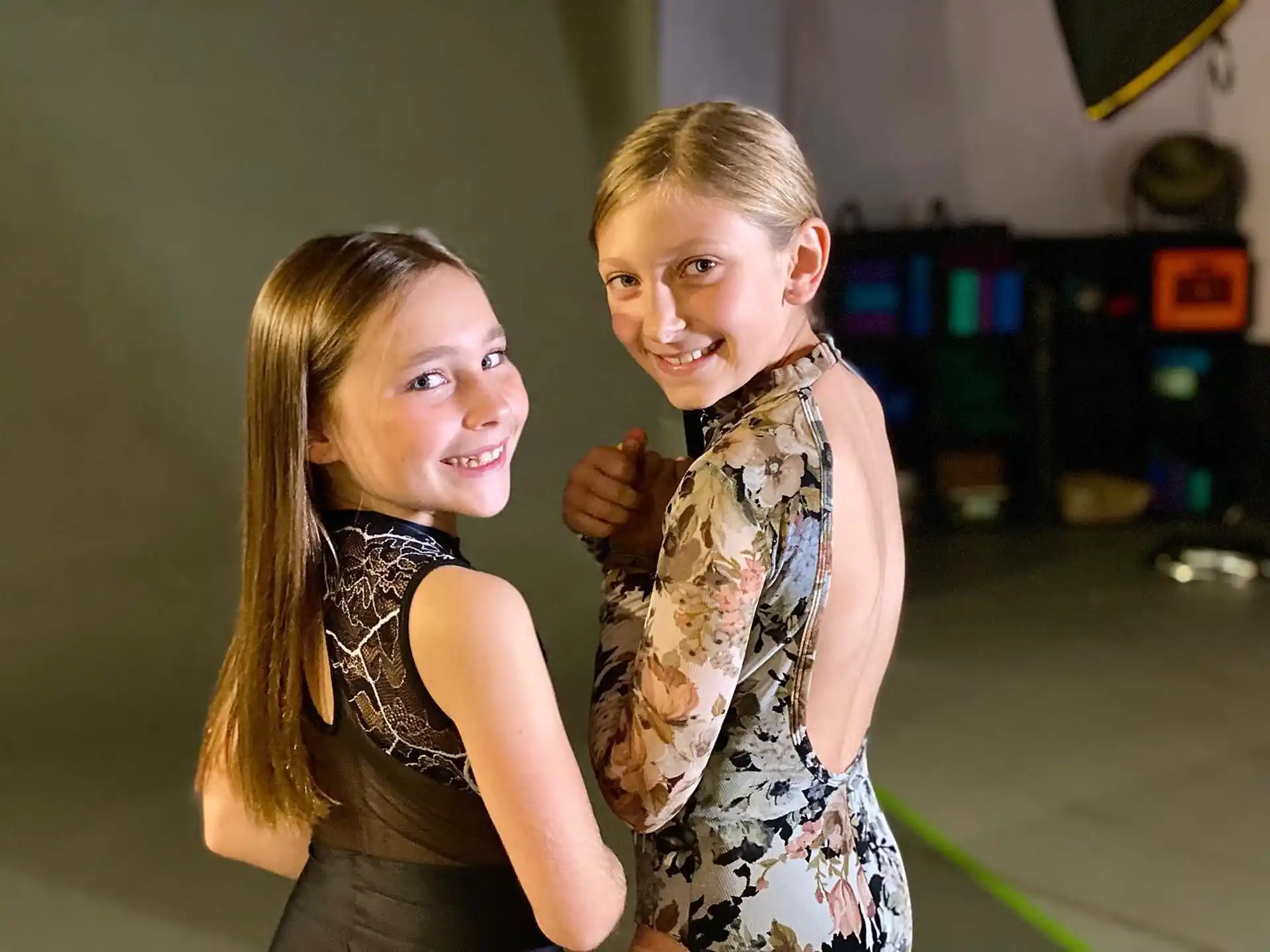 a couple of girls posing for the camera