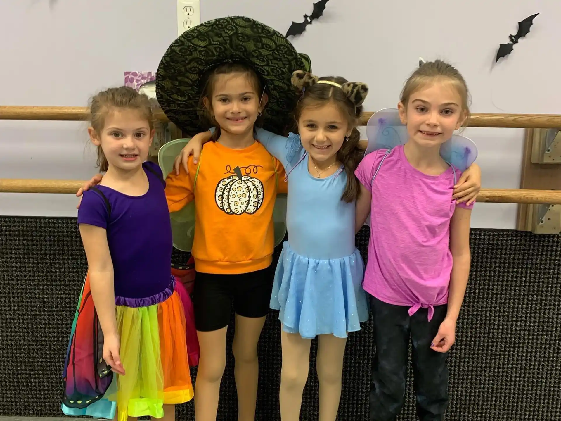 a group of girls posing for a photo