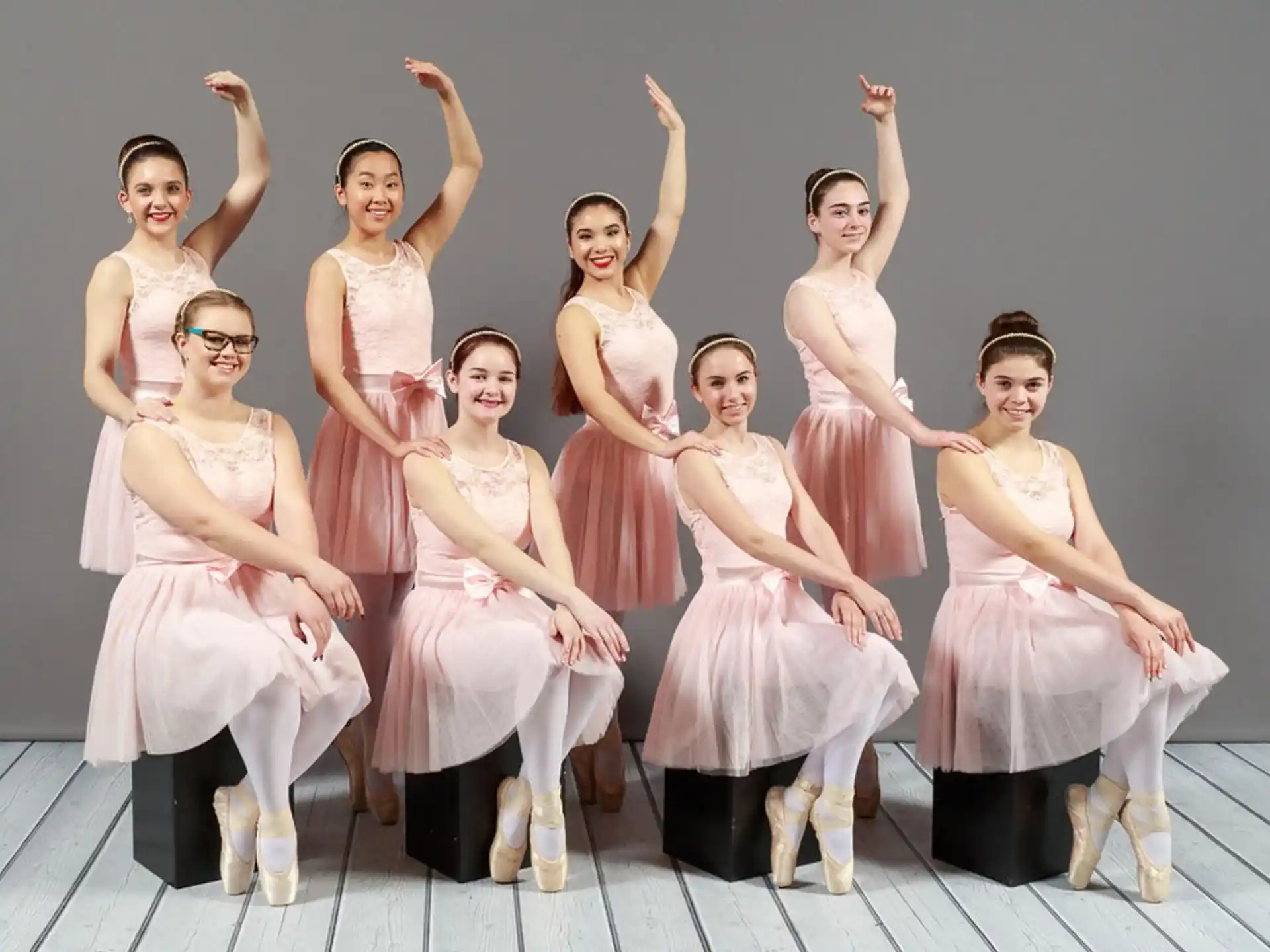 a group of women in dresses