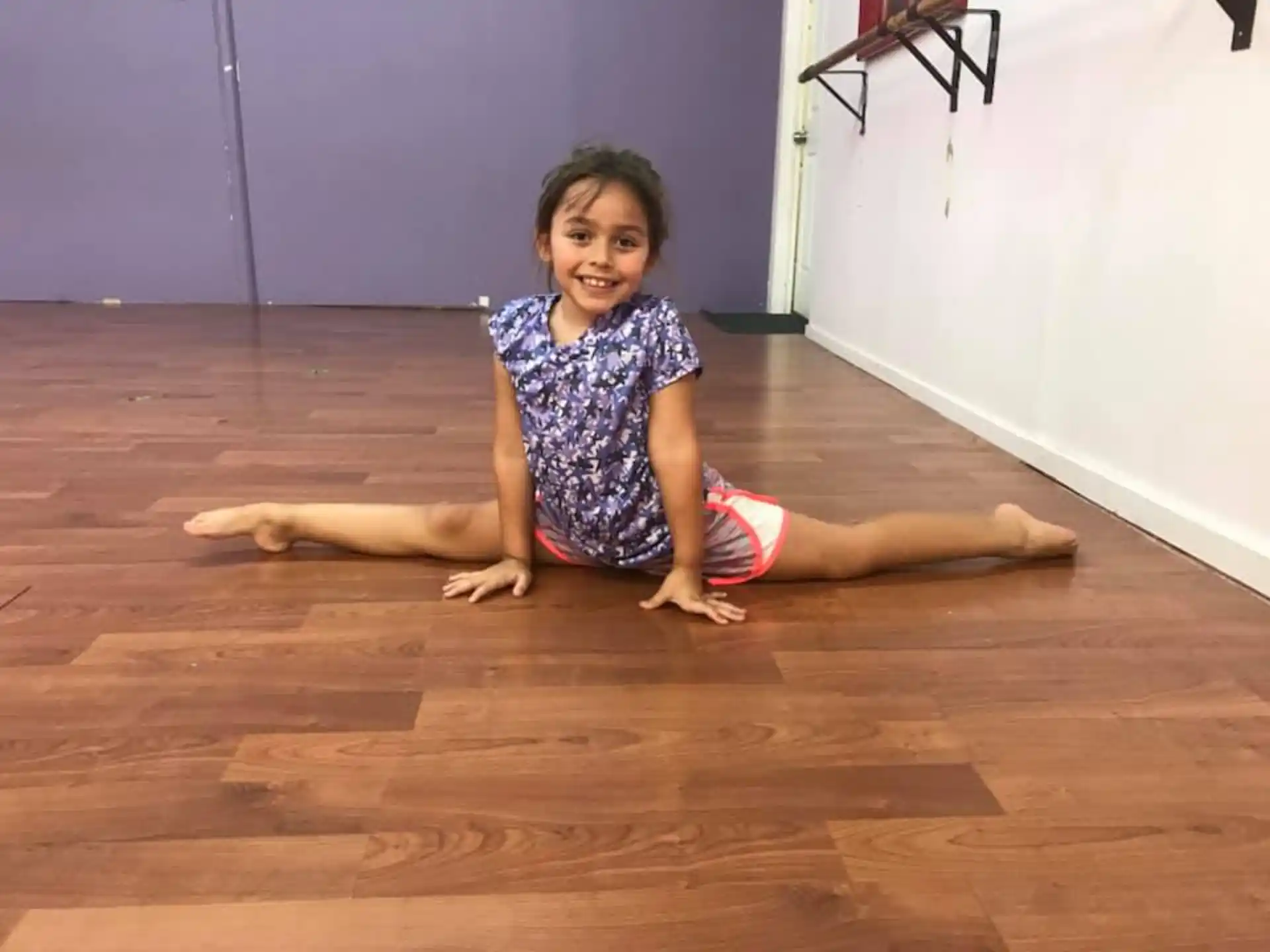 a girl sitting on the floor