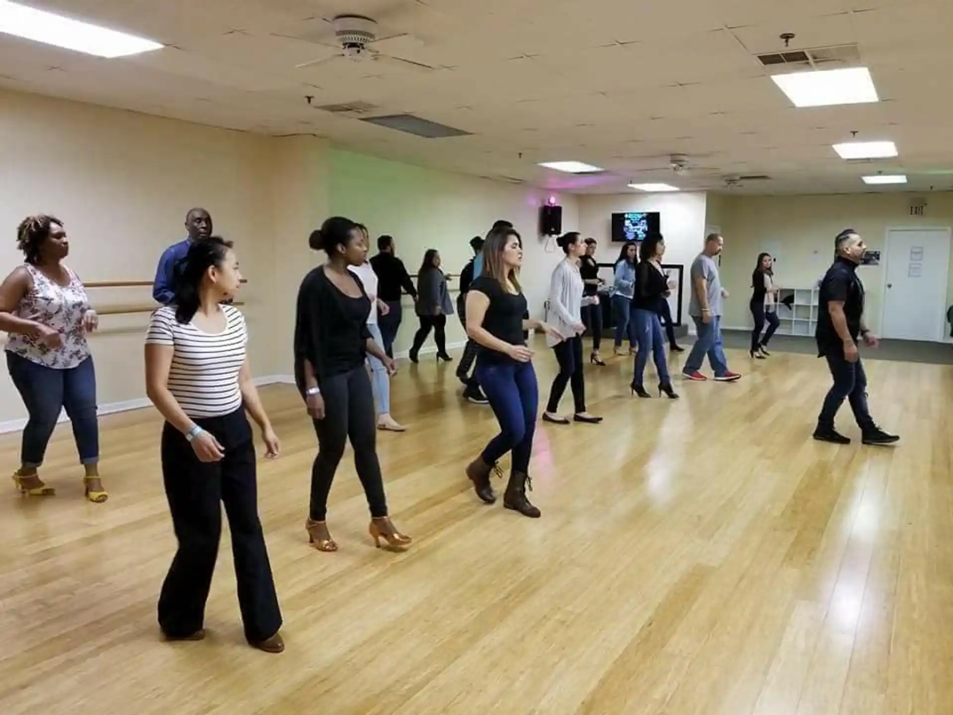 a group of people dancing in a room