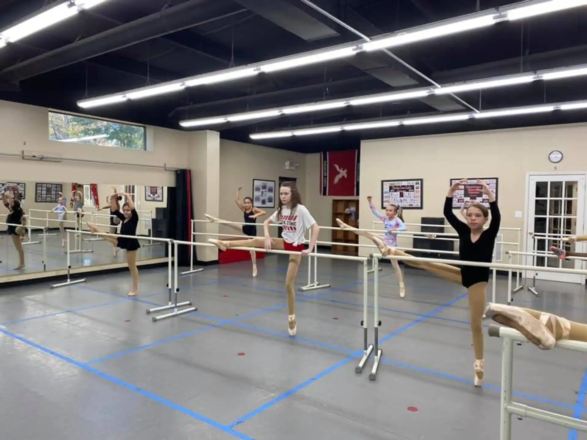 a group of people exercising in a gym