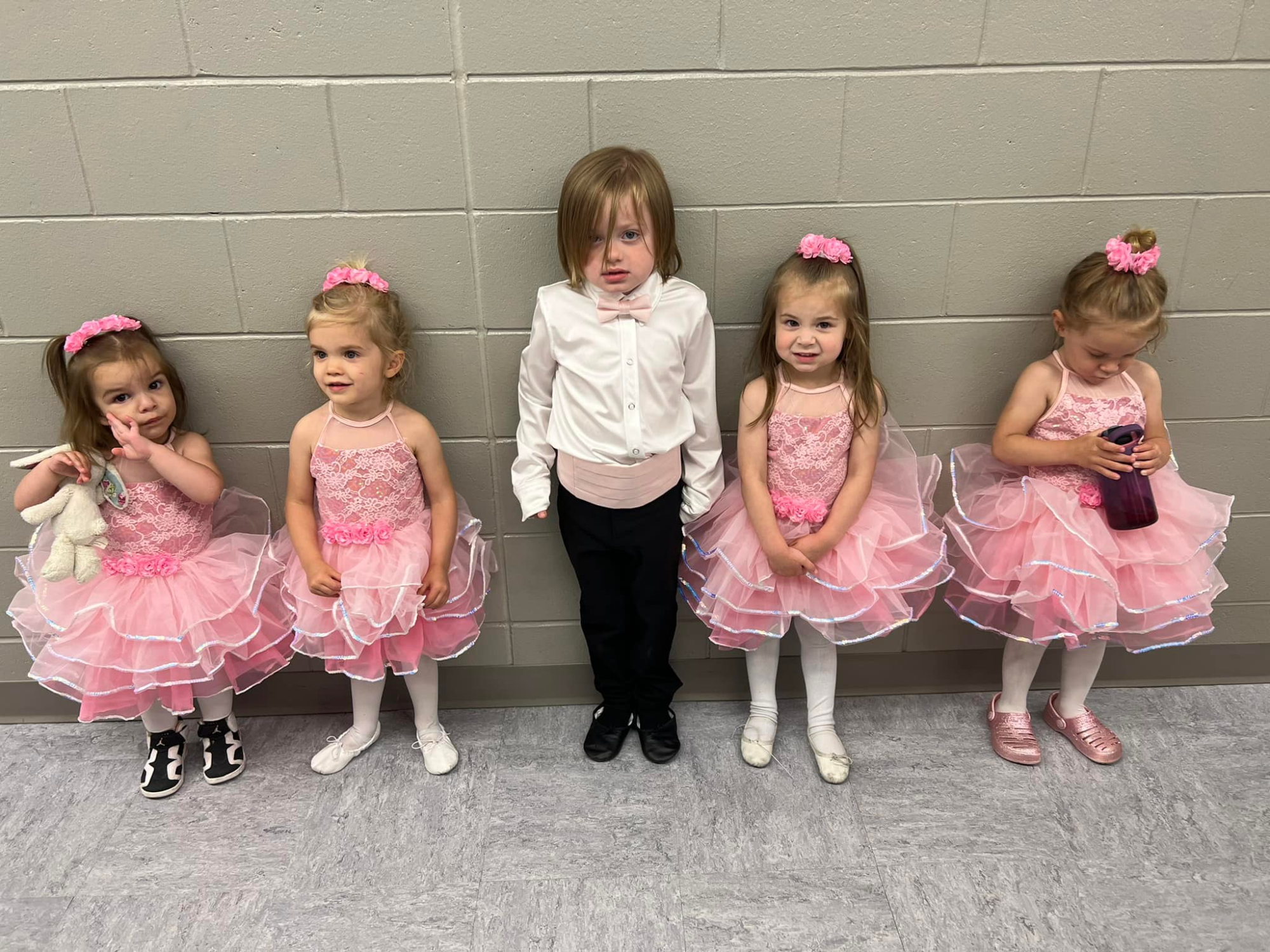 a group of girls in dresses