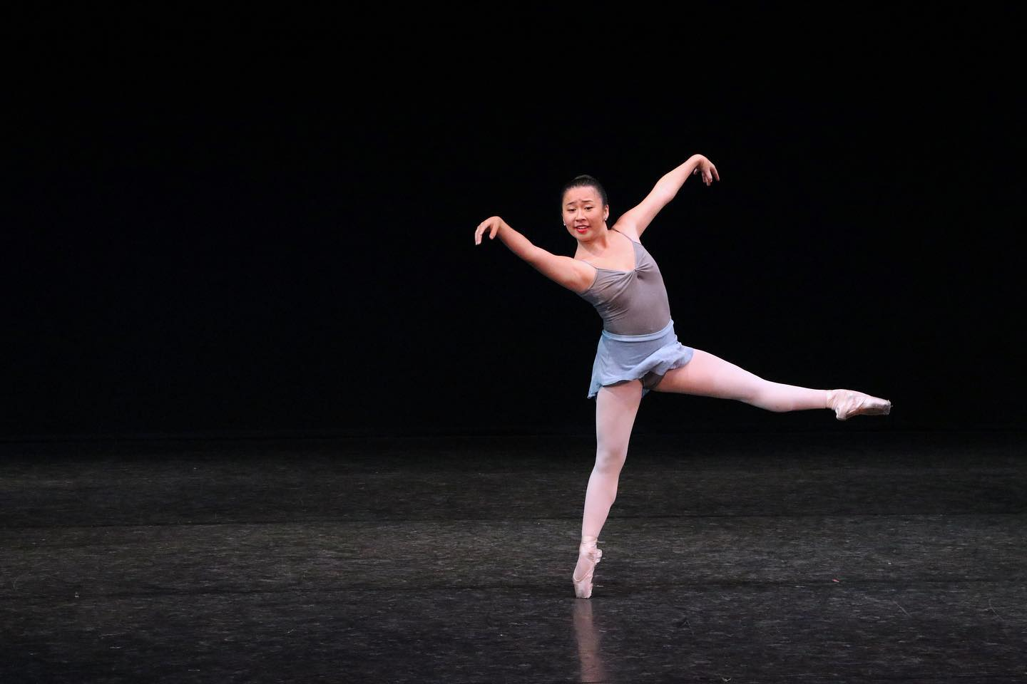 a woman dancing on a stage